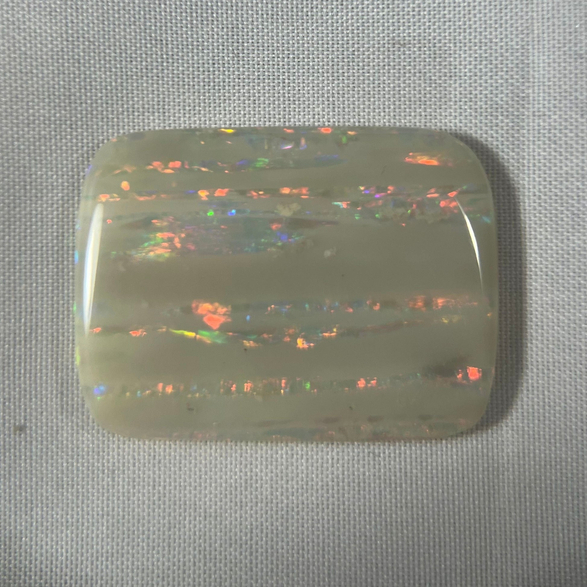 Large vertical Grawin displaying lines of magnificent colours. Can be cut or made into a huge pendant, or just kept for a perfect specimen.