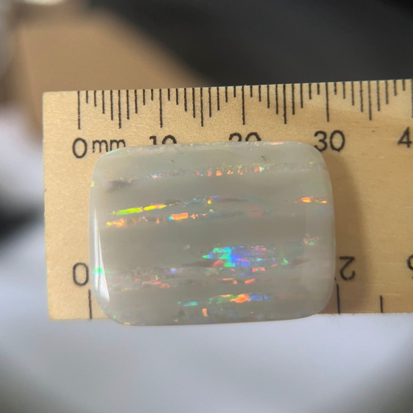 Large vertical Grawin displaying lines of magnificent colours. Can be cut or made into a huge pendant, or just kept for a perfect specimen.