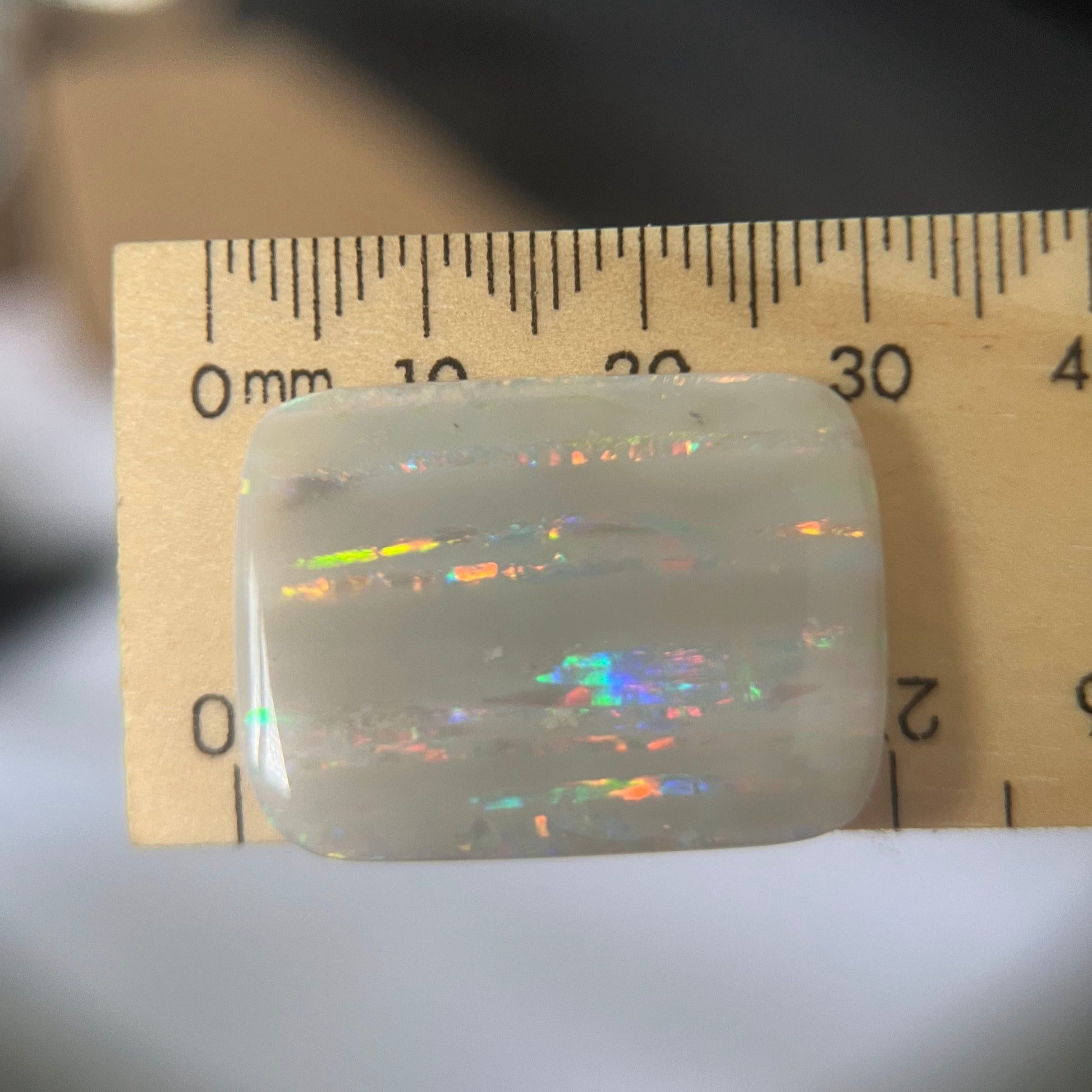 Large vertical Grawin displaying lines of magnificent colours. Can be cut or made into a huge pendant, or just kept for a perfect specimen.