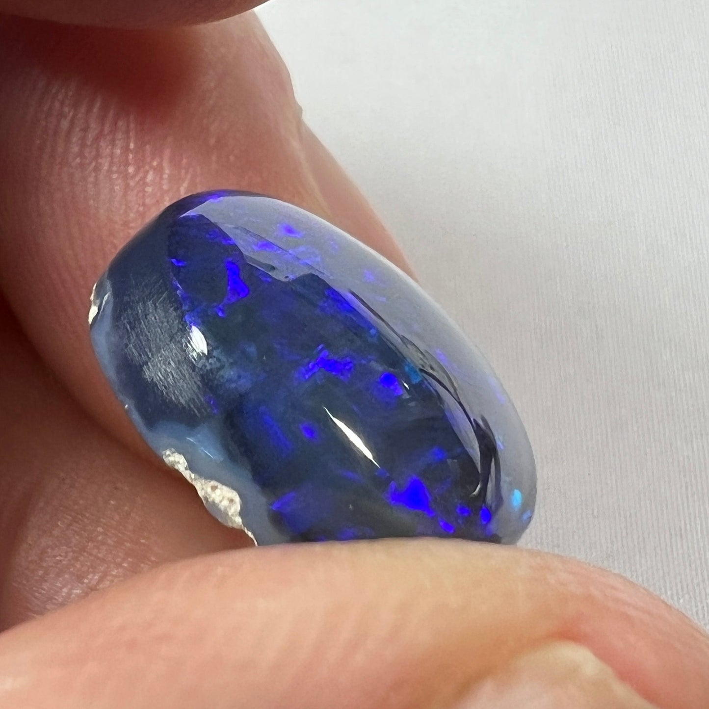 Beautiful blue on black Lightning Ridge solid opal. Rough originally supplied by the Tunnel Rats, and the precious gem supplied to us by Phoenix Opals.
