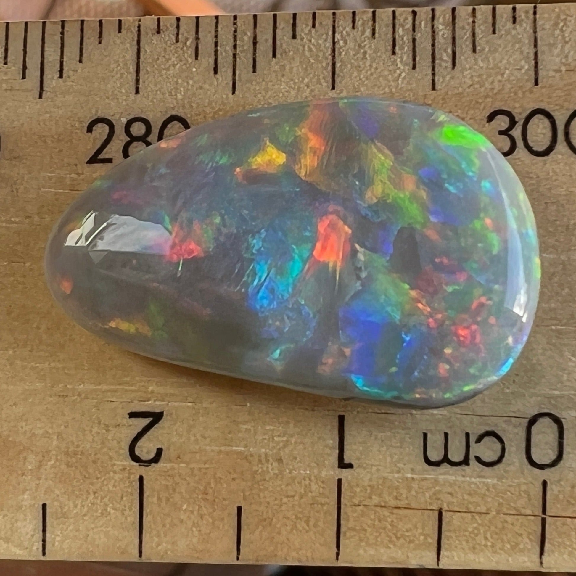 Solid Mintabie black opal. Beautiful specimen displaying a magnificent play of colour.