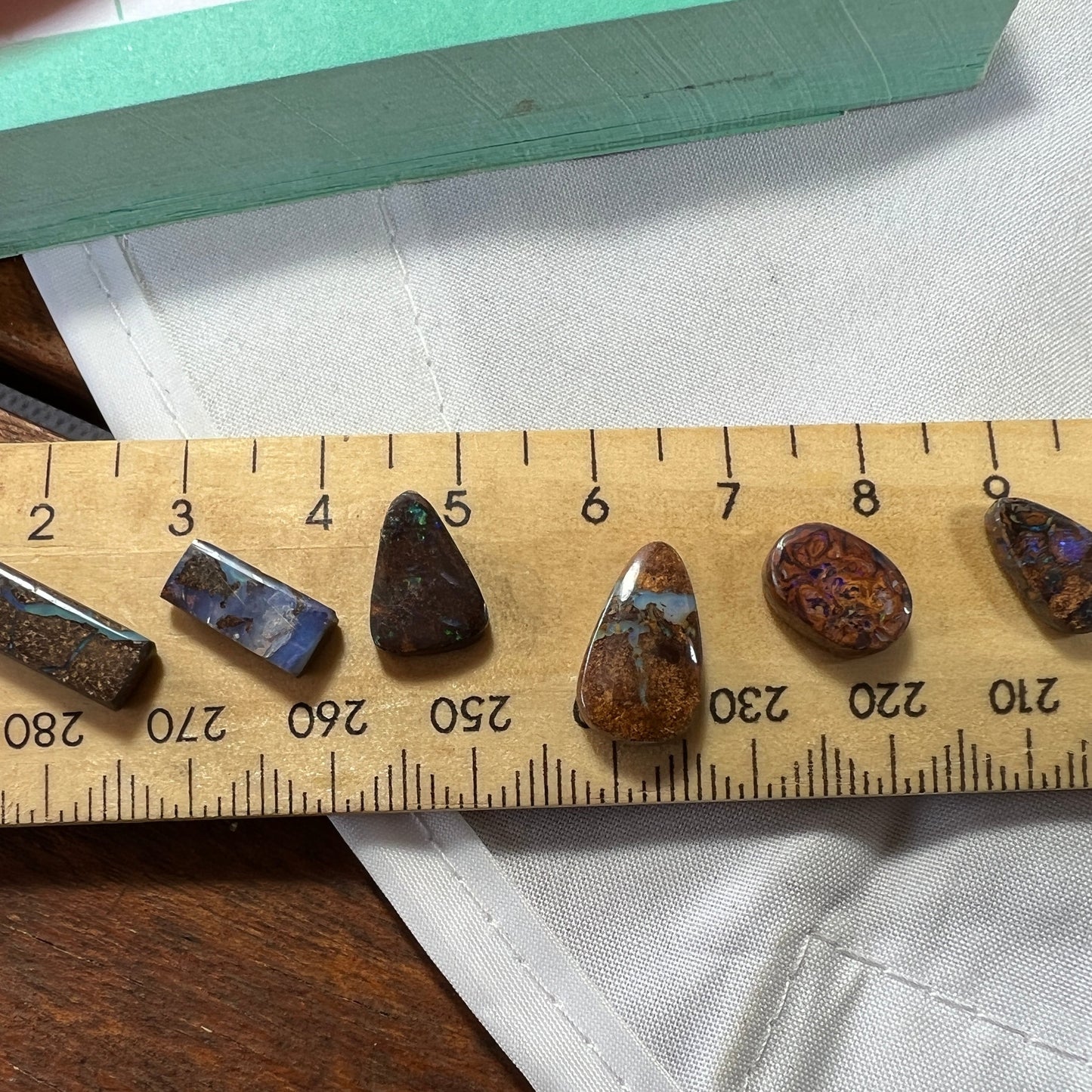 Nice group of 6 Winton boulder opals. Nice cut and polish.