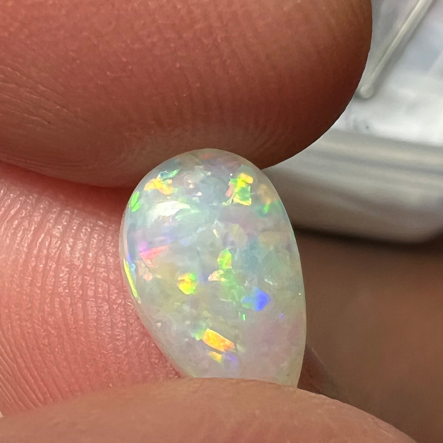 Gorgeous solid opal displaying an array of magnificent colours. Cut and polished to perfection, and ready to set.