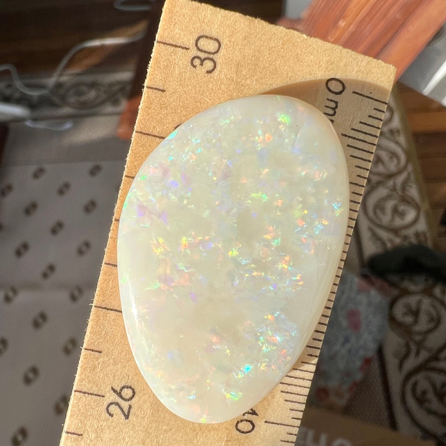 Large Coober Pedy solid white opal. Lots of colours and beautifully polished. Would make a great pendant. Double sided.