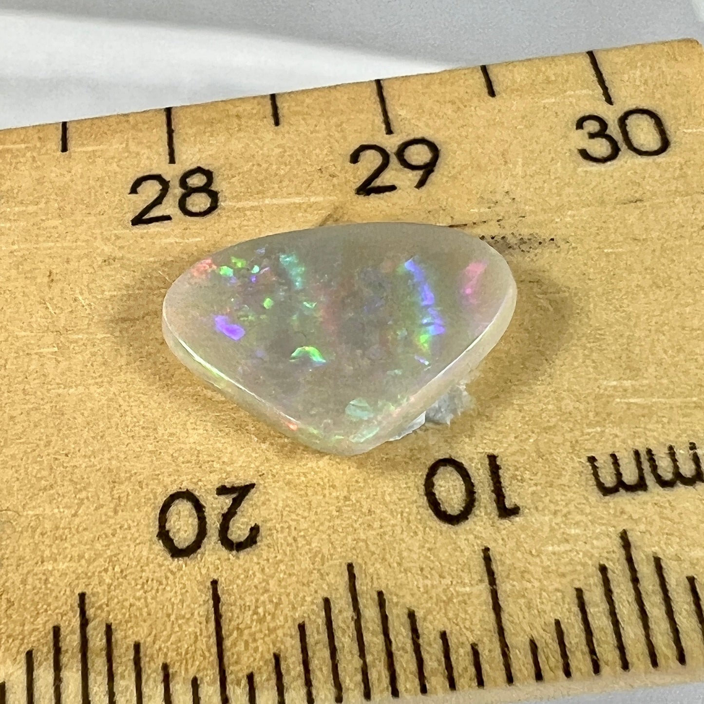 Nice semi black opal from Lightning Ridge, displaying brilliant flashes of colour.