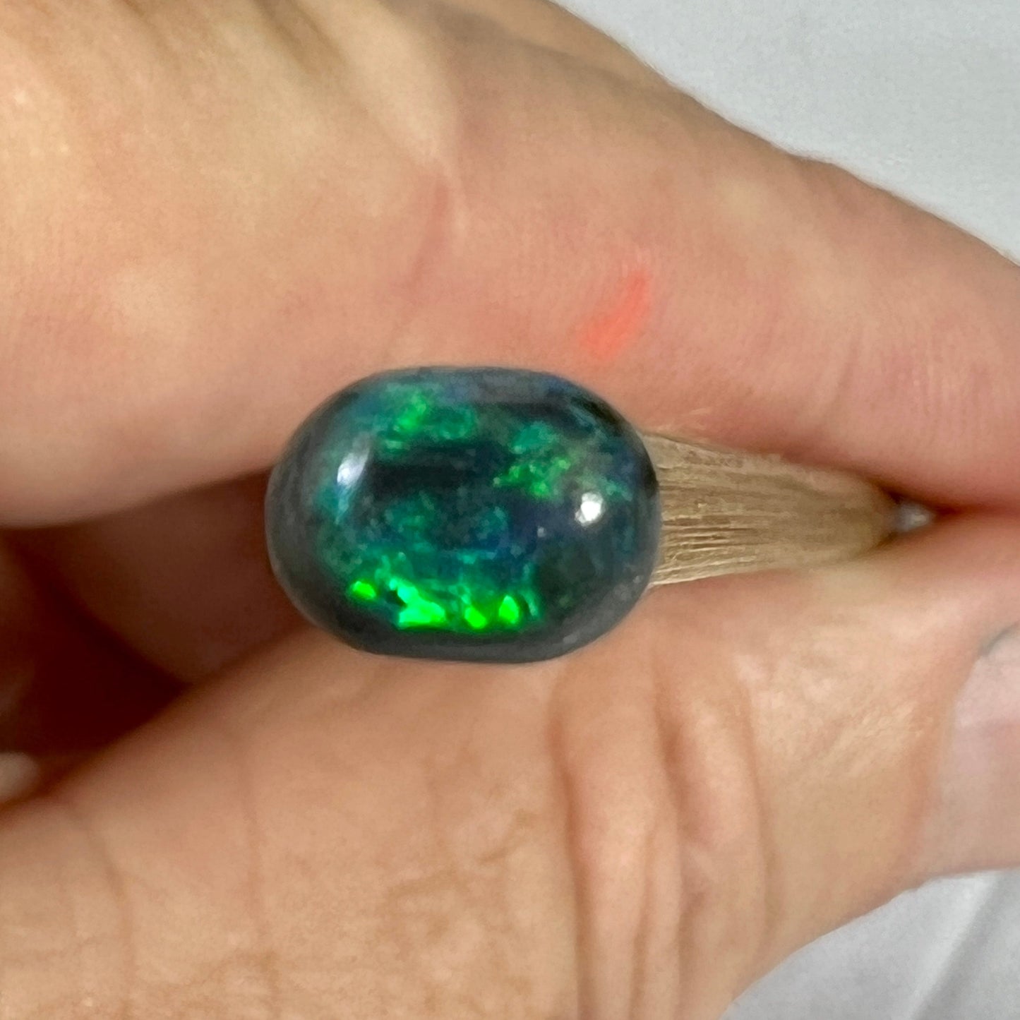 Nice little solid black opal from Lightning Ridge, displaying beautiful greens. Would make a great ring stone.