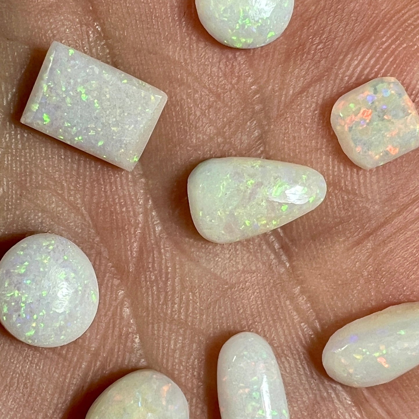 Solid white opal bundle comprising of 8 beautiful Coober Pedy ring stones in various shapes. Mainly pin fire. Ideal for jewellery makers.