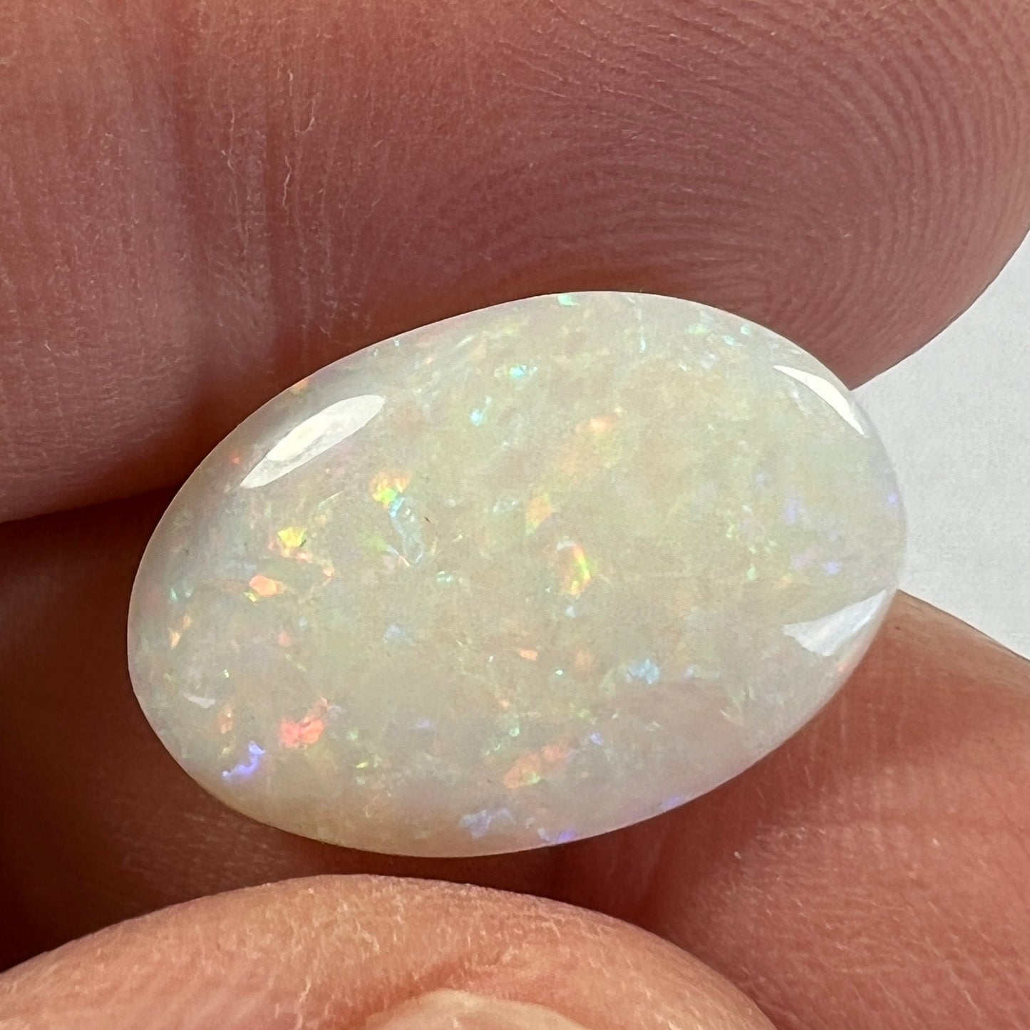 Double sided Coober Pedy solid white opal. beautifully displaying all colours in a pin fire pattern. Ready to go.