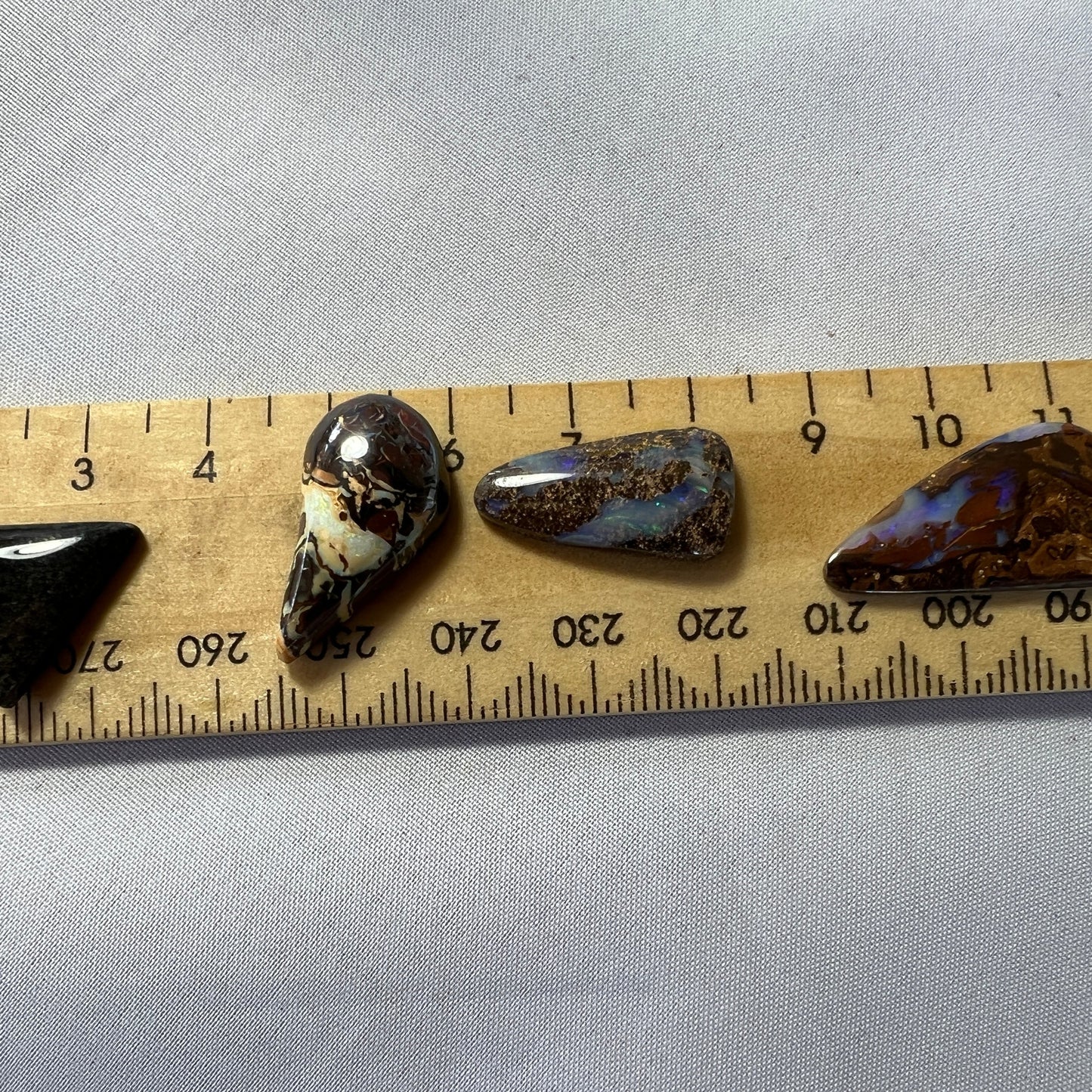 3 x Winton and 1 x Andamooka Matrix. Nicely polished with good colours.