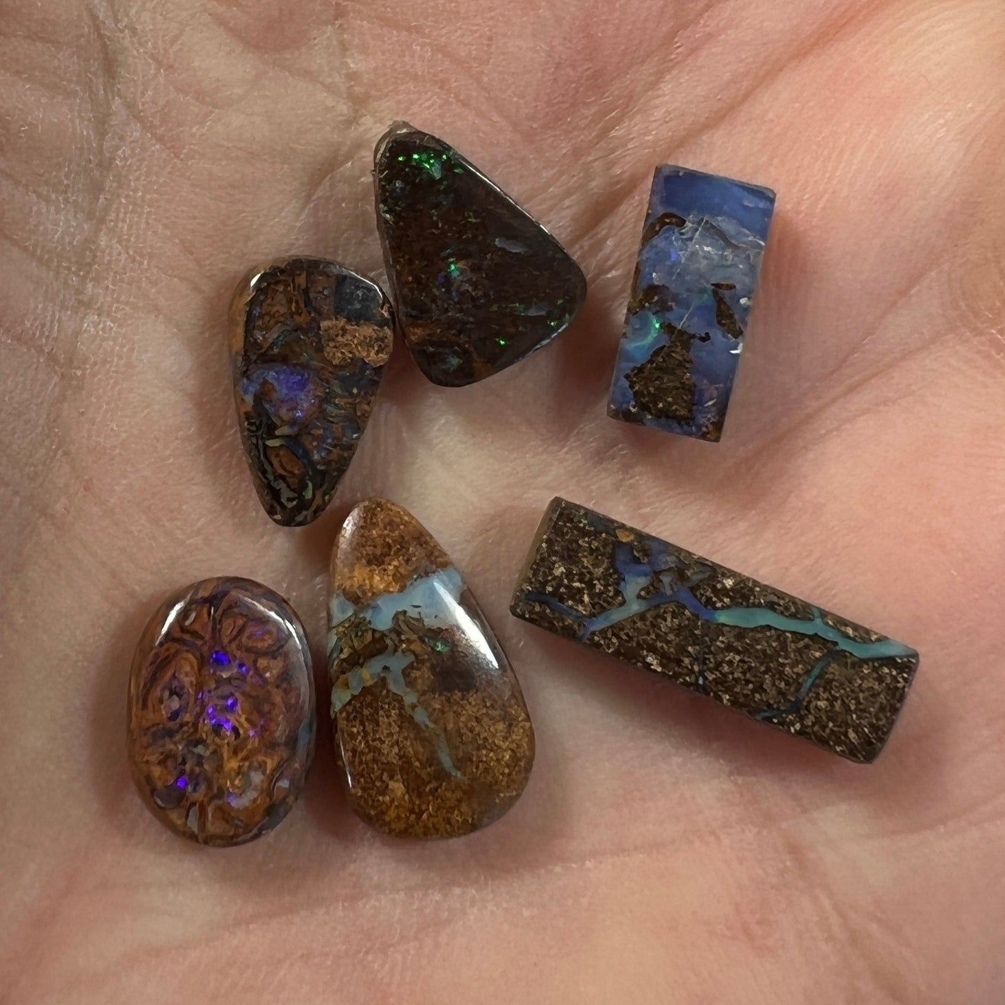 Nice group of 6 Winton boulder opals. Nice cut and polish.