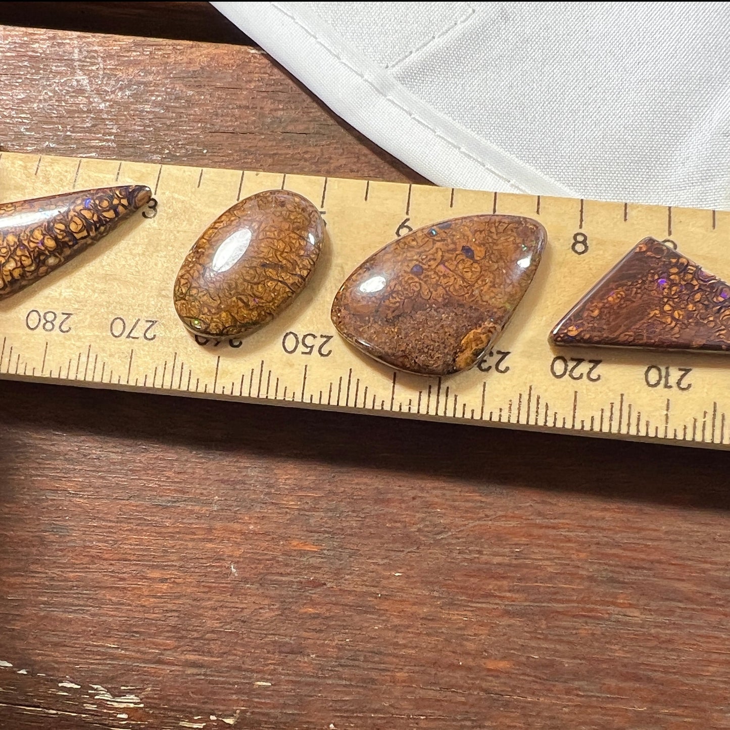 Four lovely Winton bolder opals, with great cut and polish. Bright colours with rolling flash.
