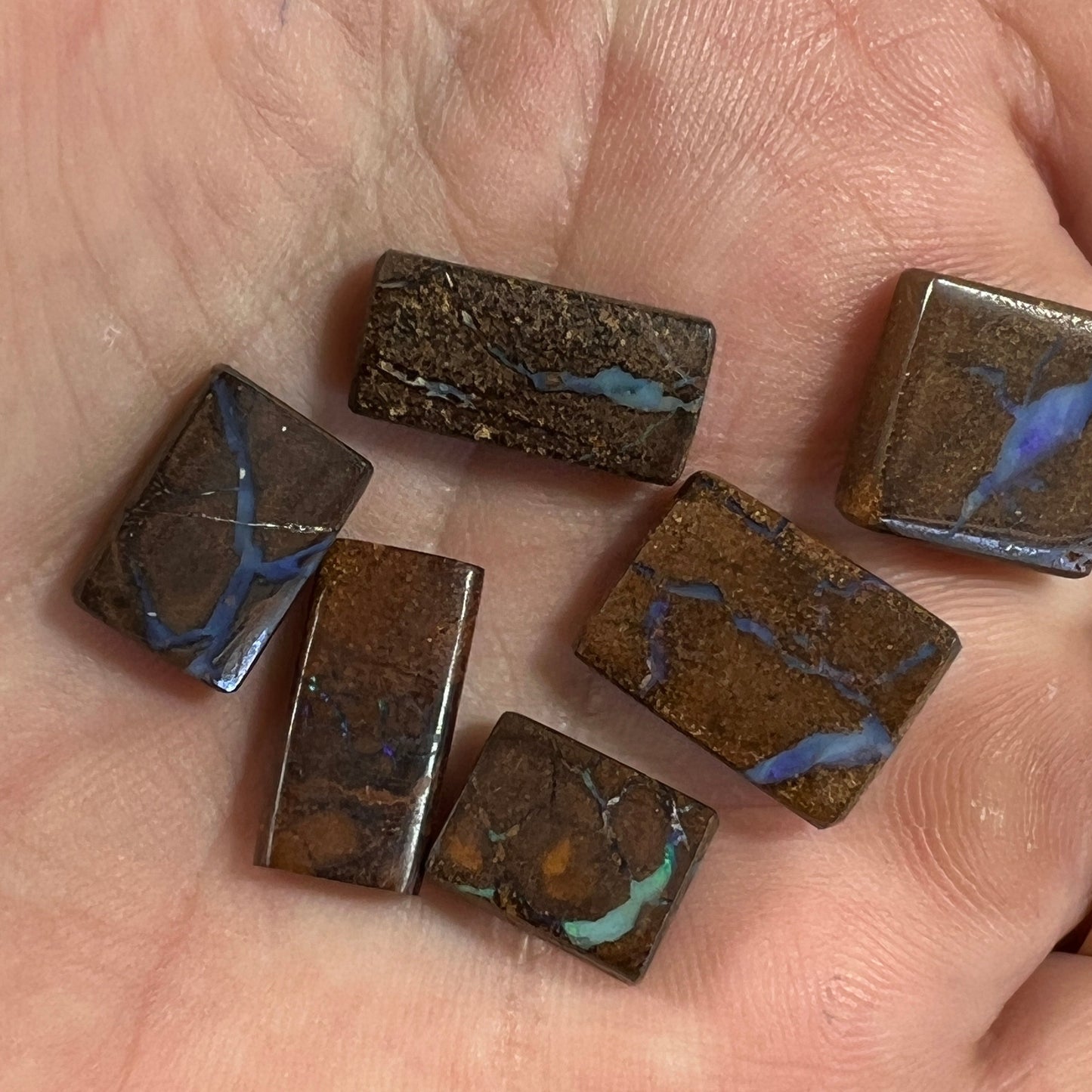 Six nice square cut boulder opals from Winton. Nice polish and ready for opal jewellery.