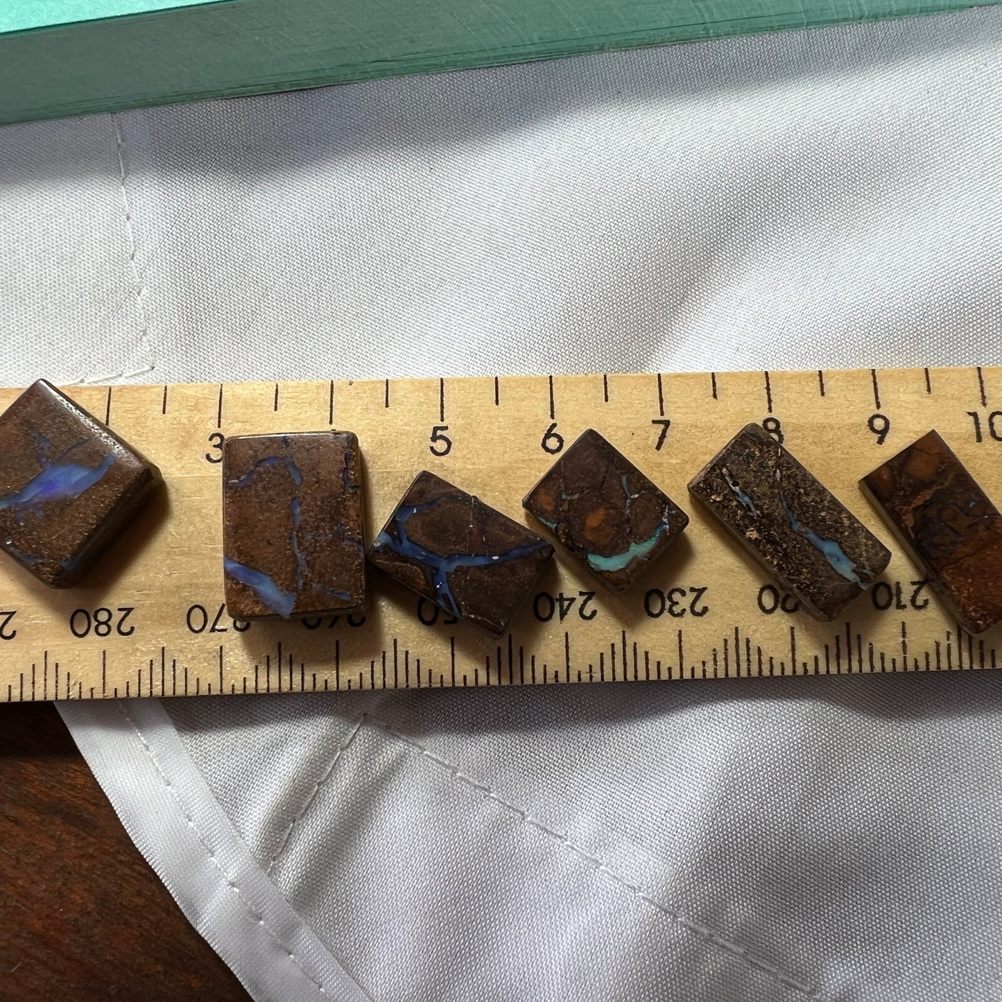Six nice square cut boulder opals from Winton. Nice polish and ready for opal jewellery.