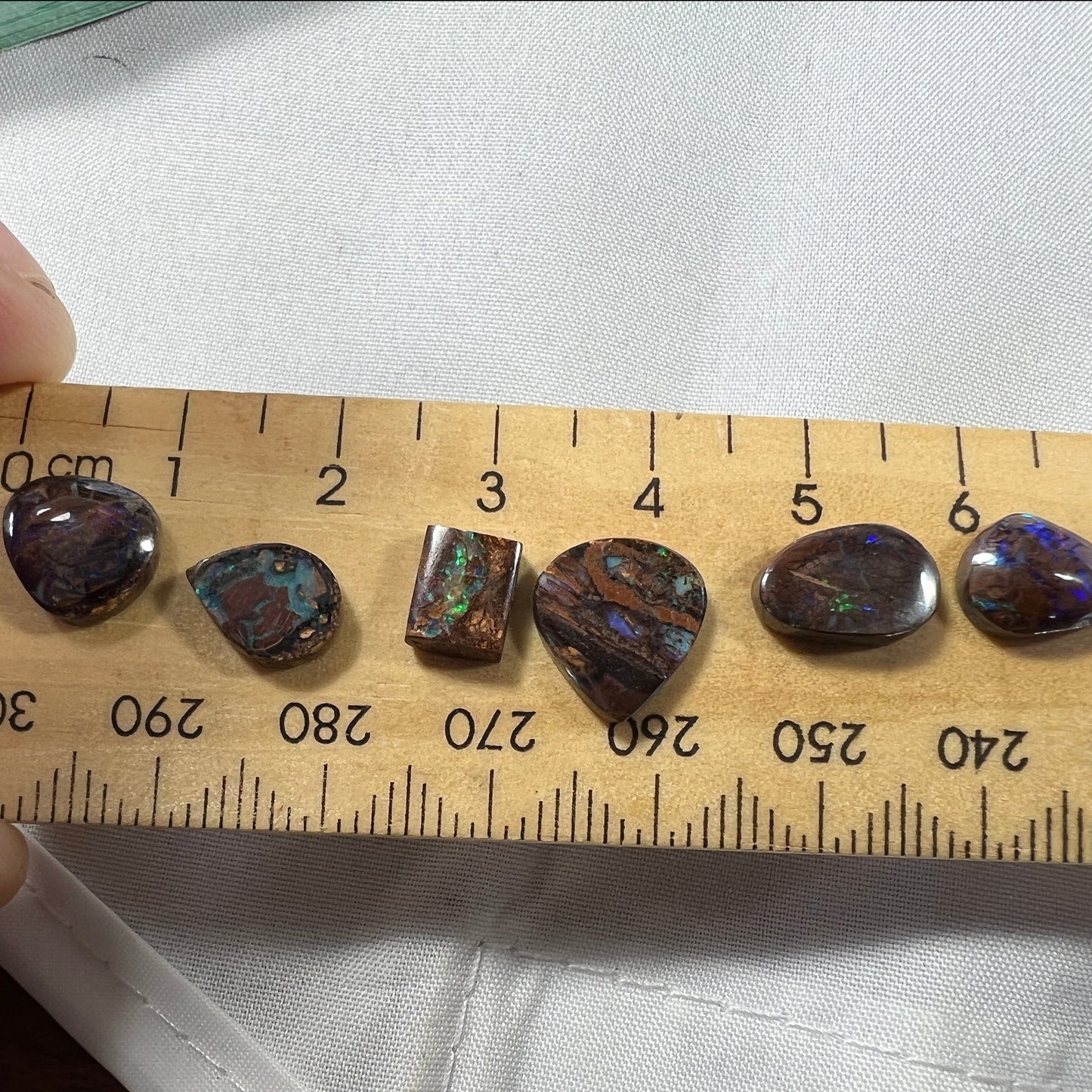 Six lovely boulder opals. Great little coloured pieces.