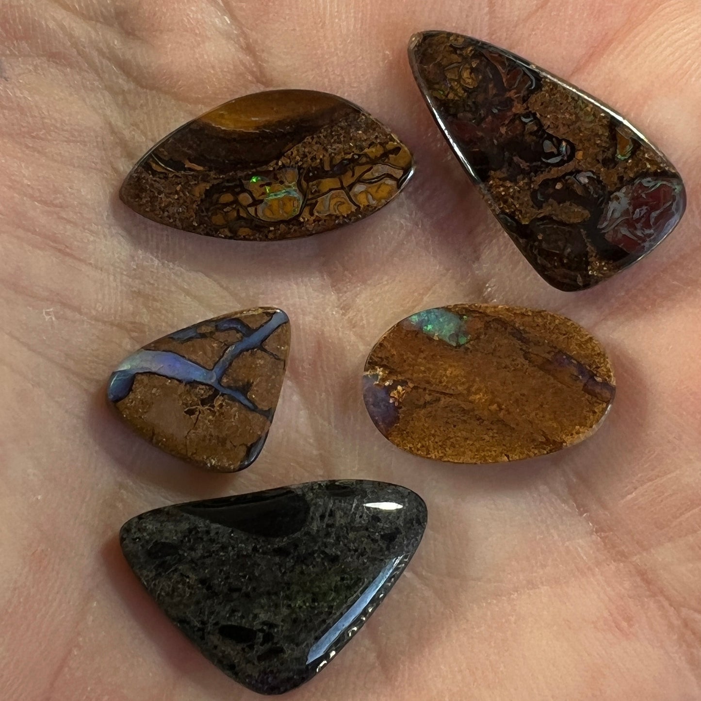 4 x Winton opals and 1 x Andamooka Matrix opal. Beautiful specimens showing lovely colours. Polished and ready to set.