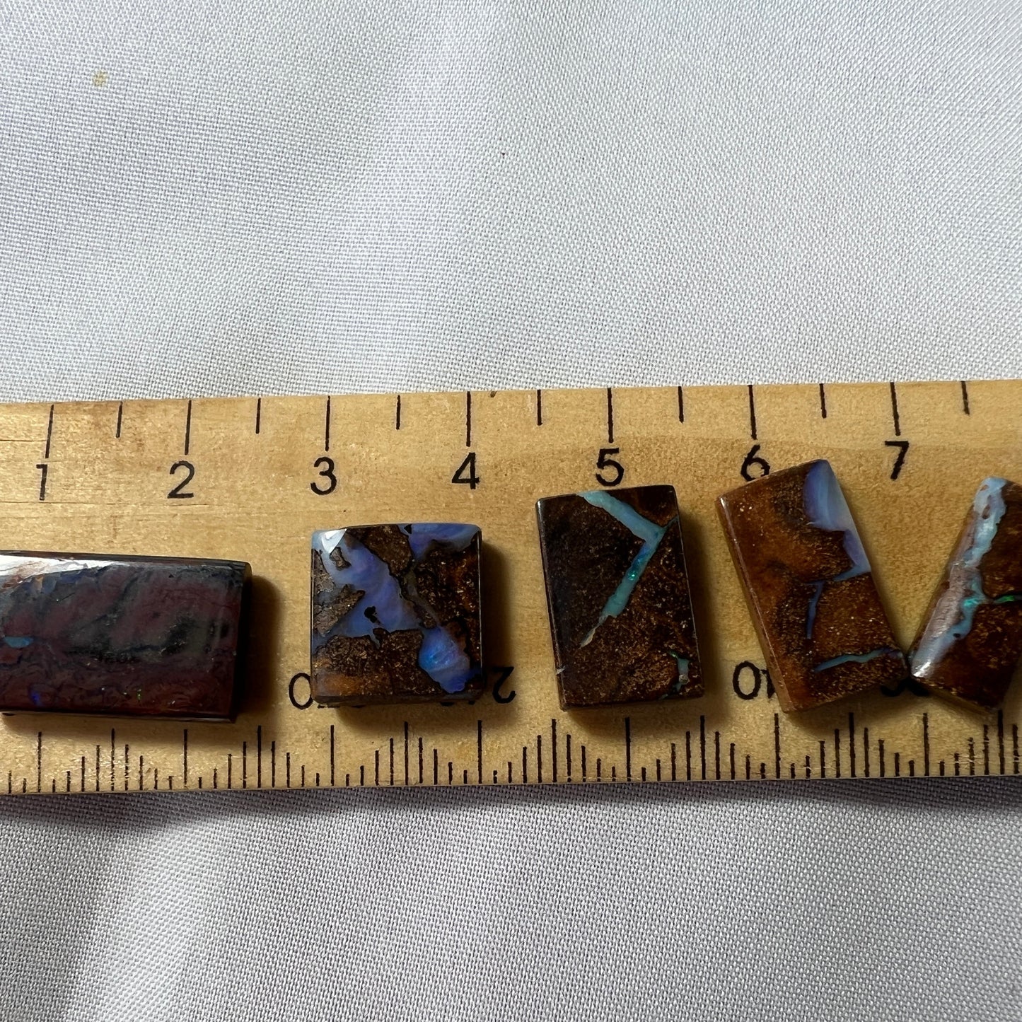 Five square cut boulder opals from Winton. Nice polish.