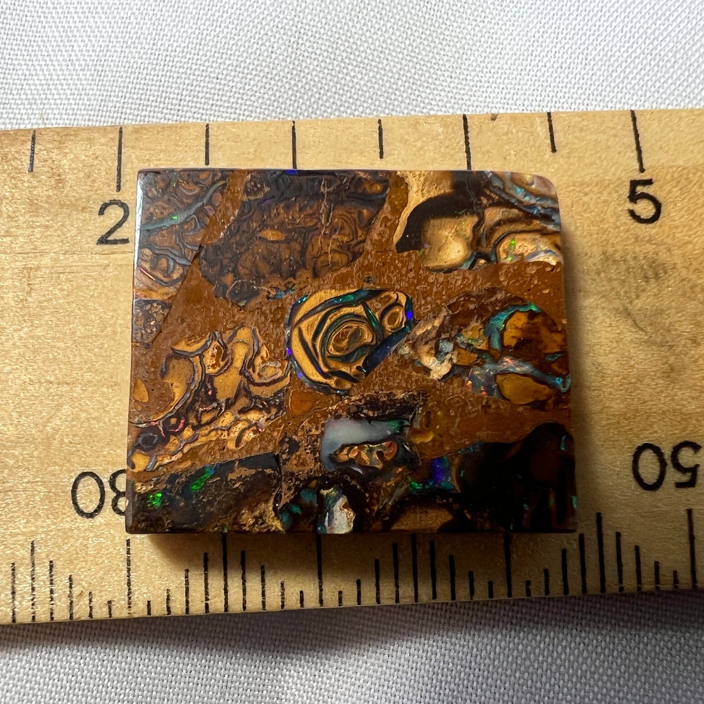 Square cut boulder opal from Winton, displaying great colours and pattern.