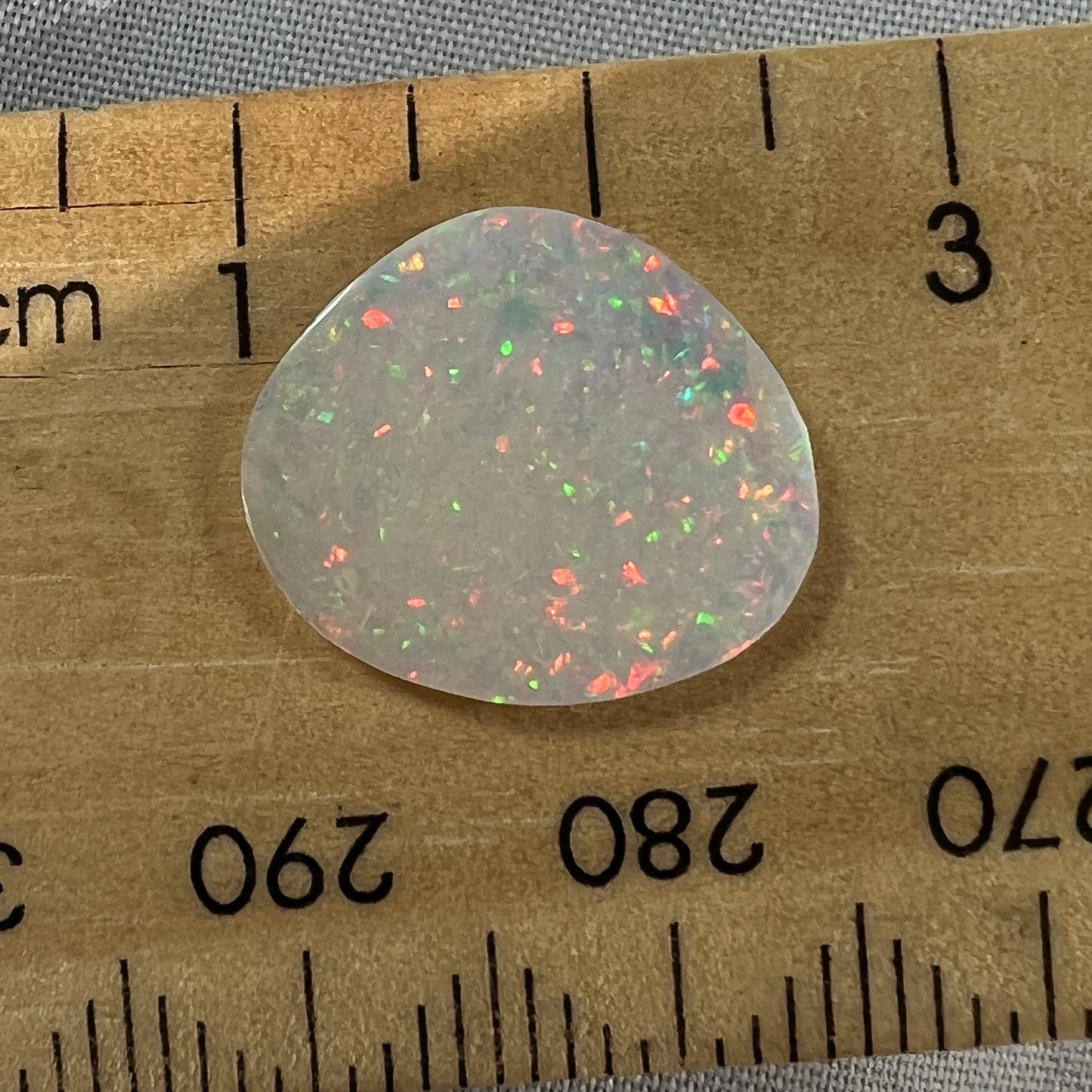 This Coober Pedy pin fire has the most amazing colours (very hard to capture). Perfectly polished by Bill Johnson.