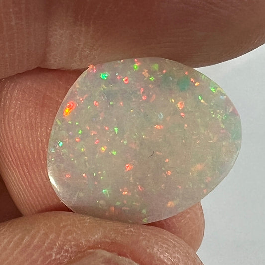 This Coober Pedy pin fire has the most amazing colours (very hard to capture). Perfectly polished by Bill Johnson.