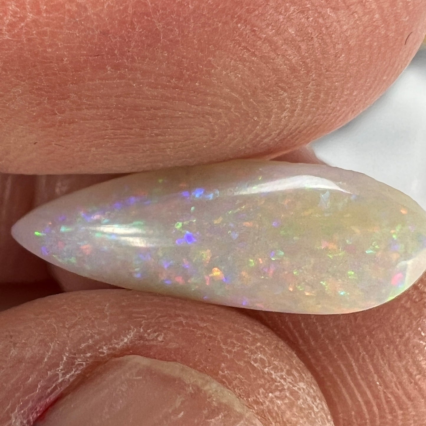 A lovely teardrop cut 2.5ct solid white Coober Pedy opal. A great example, cut by Bill Johnson.