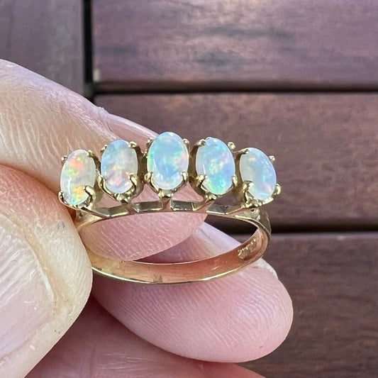 Five perfectly cut opals from Coober Pedy set into a 14ct gold ring. Beautiful matching colours. A truly beautiful ring.