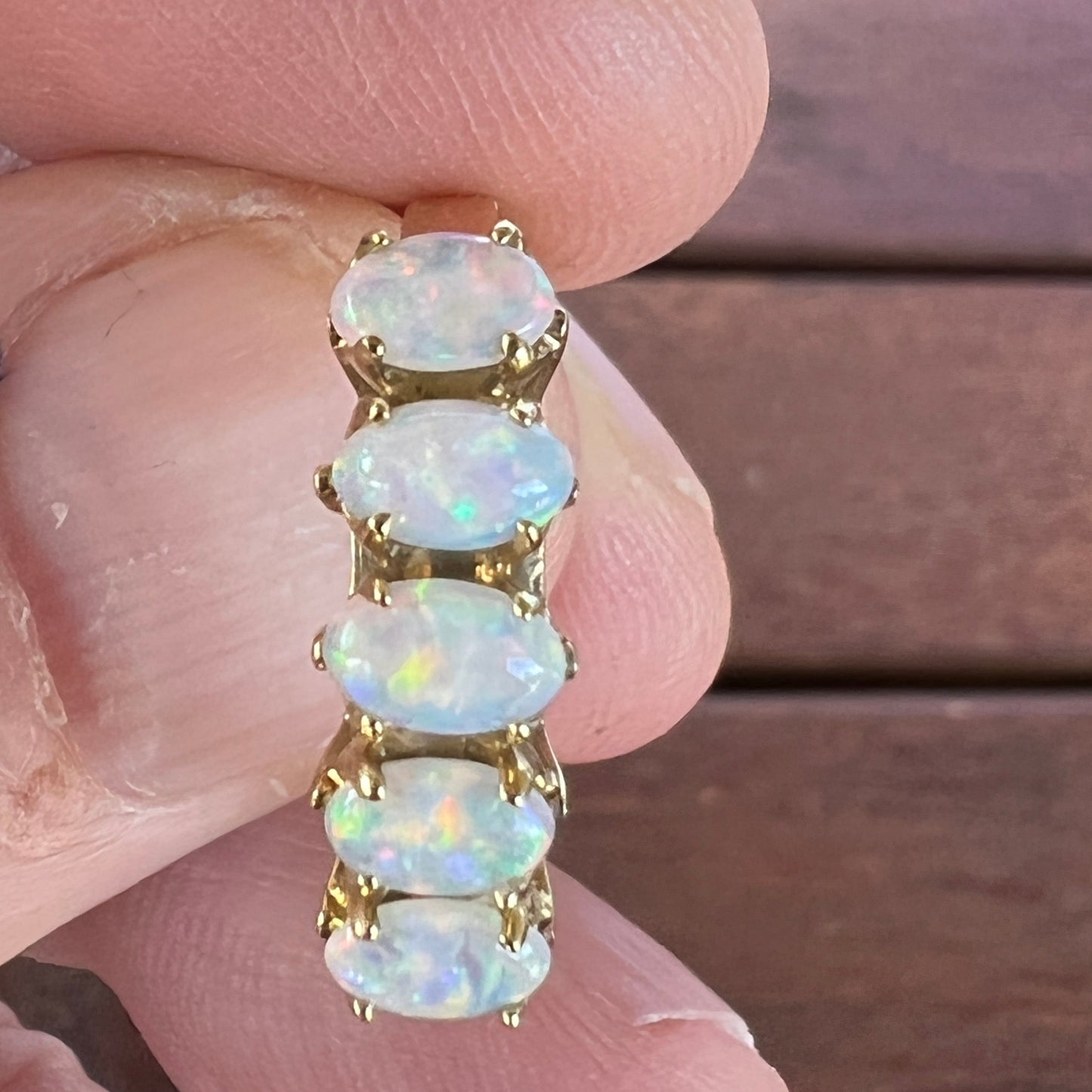 Five perfectly cut opals from Coober Pedy set into a 14ct gold ring. Beautiful matching colours. A truly beautiful ring.
