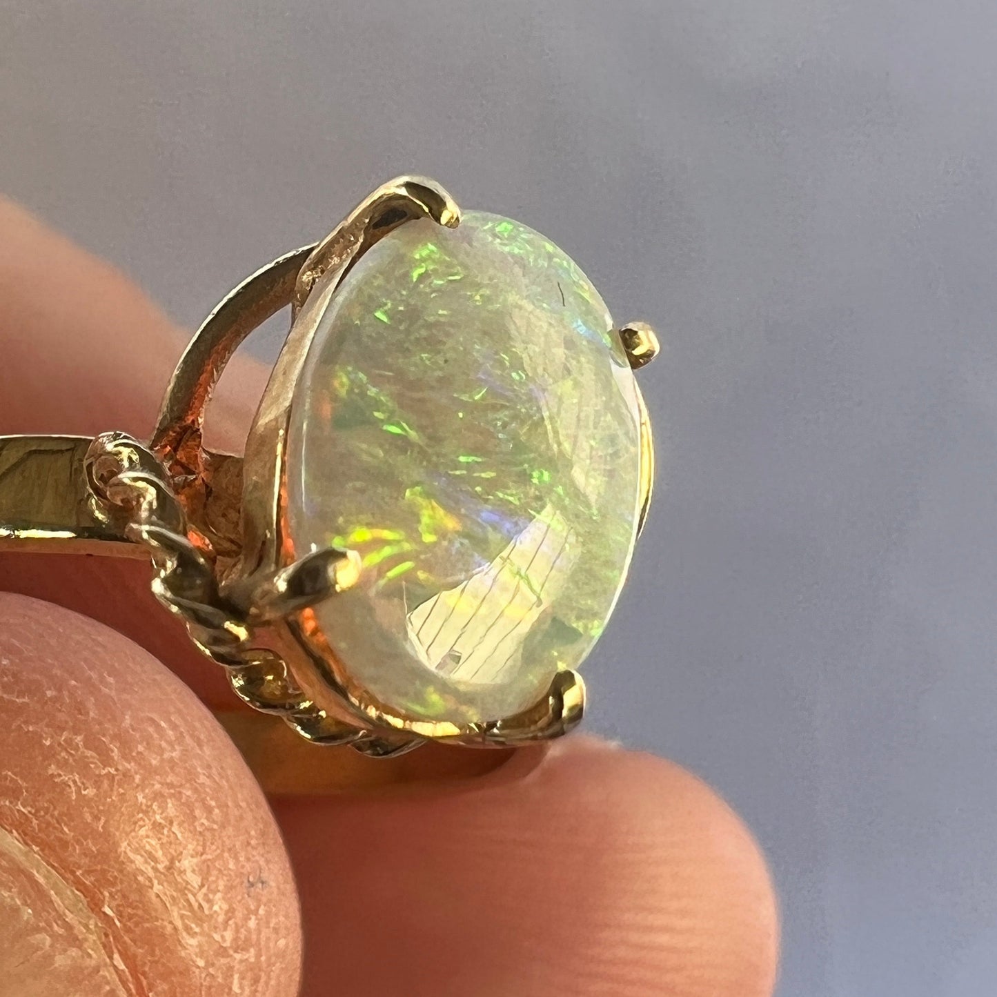 Nice bespoke Coober Pedy crystal opal set in 14ct gold with a twist!