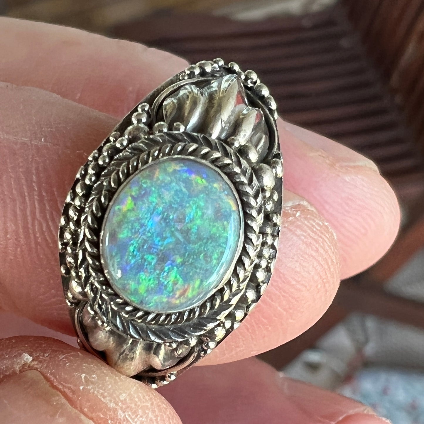 One of a kind perfectly formed silver ring with a beautiful Coober Pedy opal showing all the colours.