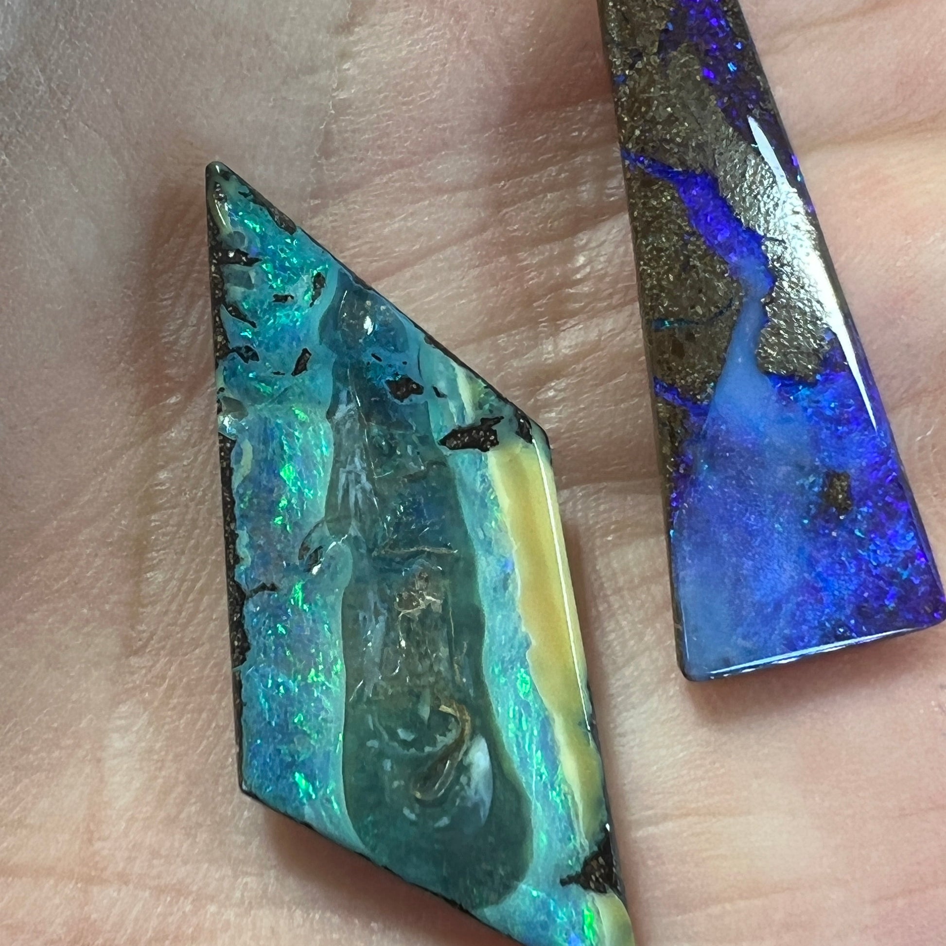 Two gorgeous pieces of boulder opal from Winton. Great colours. Polished and ready for setting.