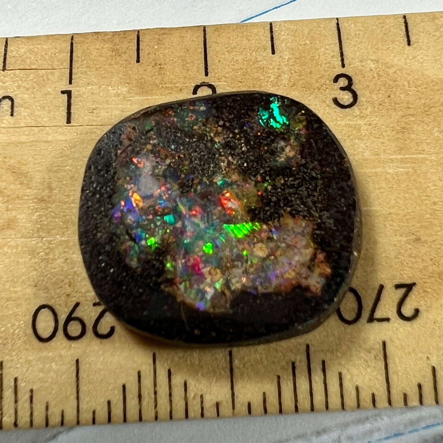 Nice round boulder opal displaying a multitude of colours.