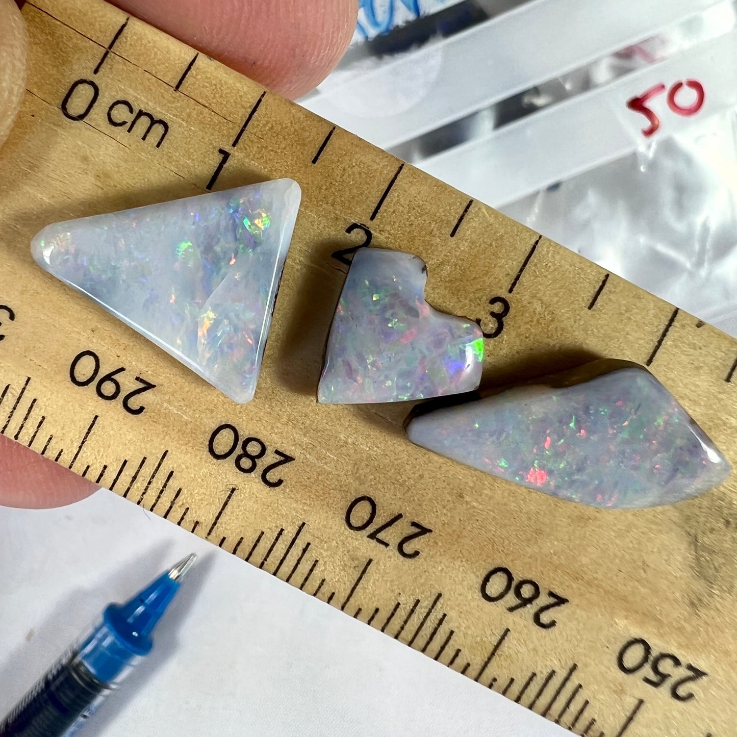 Three beautiful pieces of boulder opal from Eromanga, Queensland. Nice pin fire pattern displaying reds and greens.