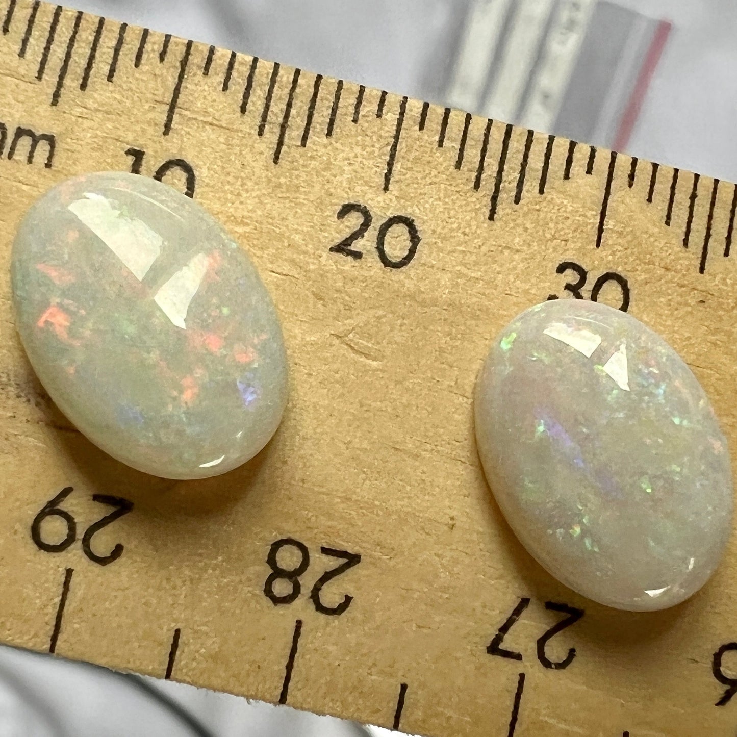 Pair of solid white opals from Coober Pedy. Cabochon cut with pin fire pattern. A matching pair would look great as earrings or anything you want.