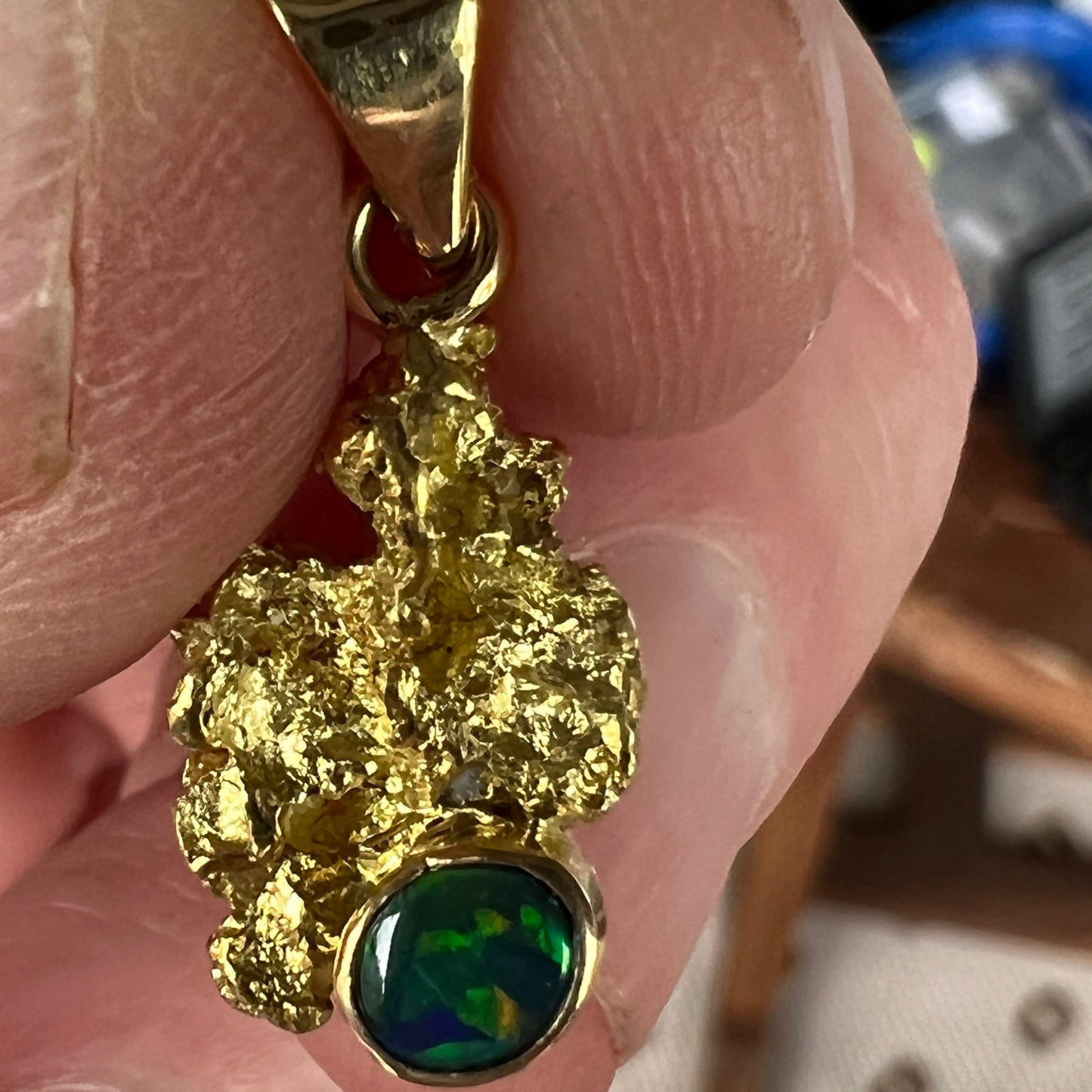 Pure solid gold nugget pendant from Western Australia. Perfectly set with an 18ct bale. Set with a beautifully cut black opal from Lightning Ridge.