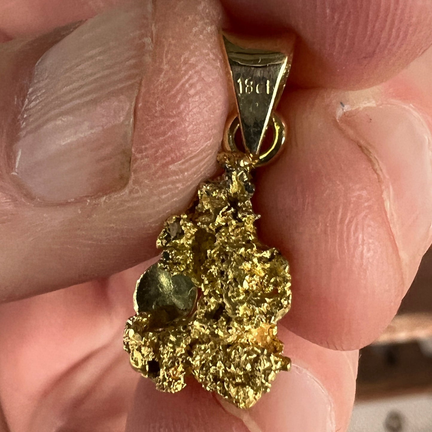 Pure solid gold nugget pendant from Western Australia, with an 18ct gold bale. Set with a beautiful solid black opal from Lightning Ridge.
