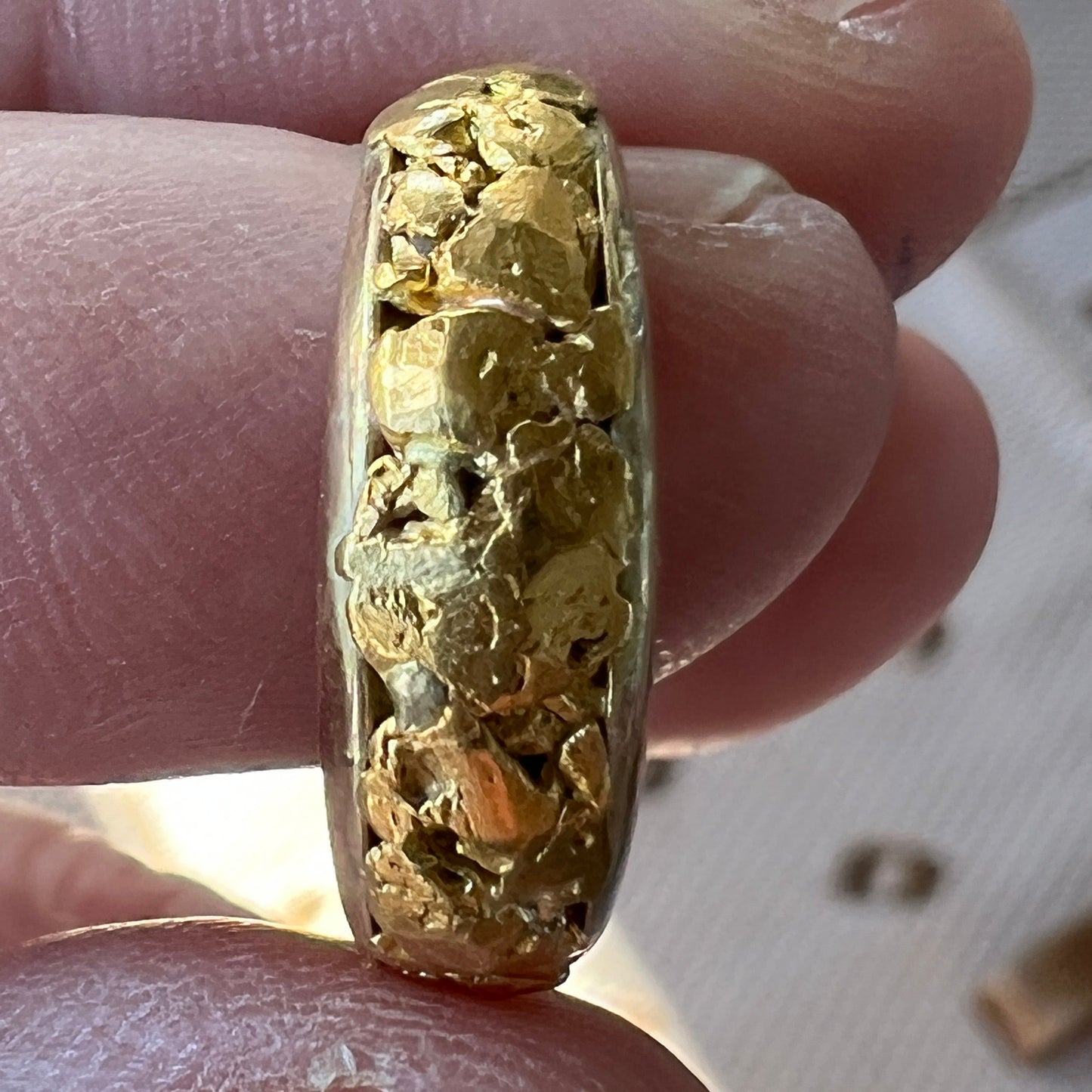 Totally unique handmade ladies gold nugget ring. Finest 9ct Australian gold filled with genuine gold nuggets from the Victorian goldfields. Also available in a mans ring for a matching pair. 3g of Australian 9ct gold and 1.5g of Victorian genuine gold nuggets.