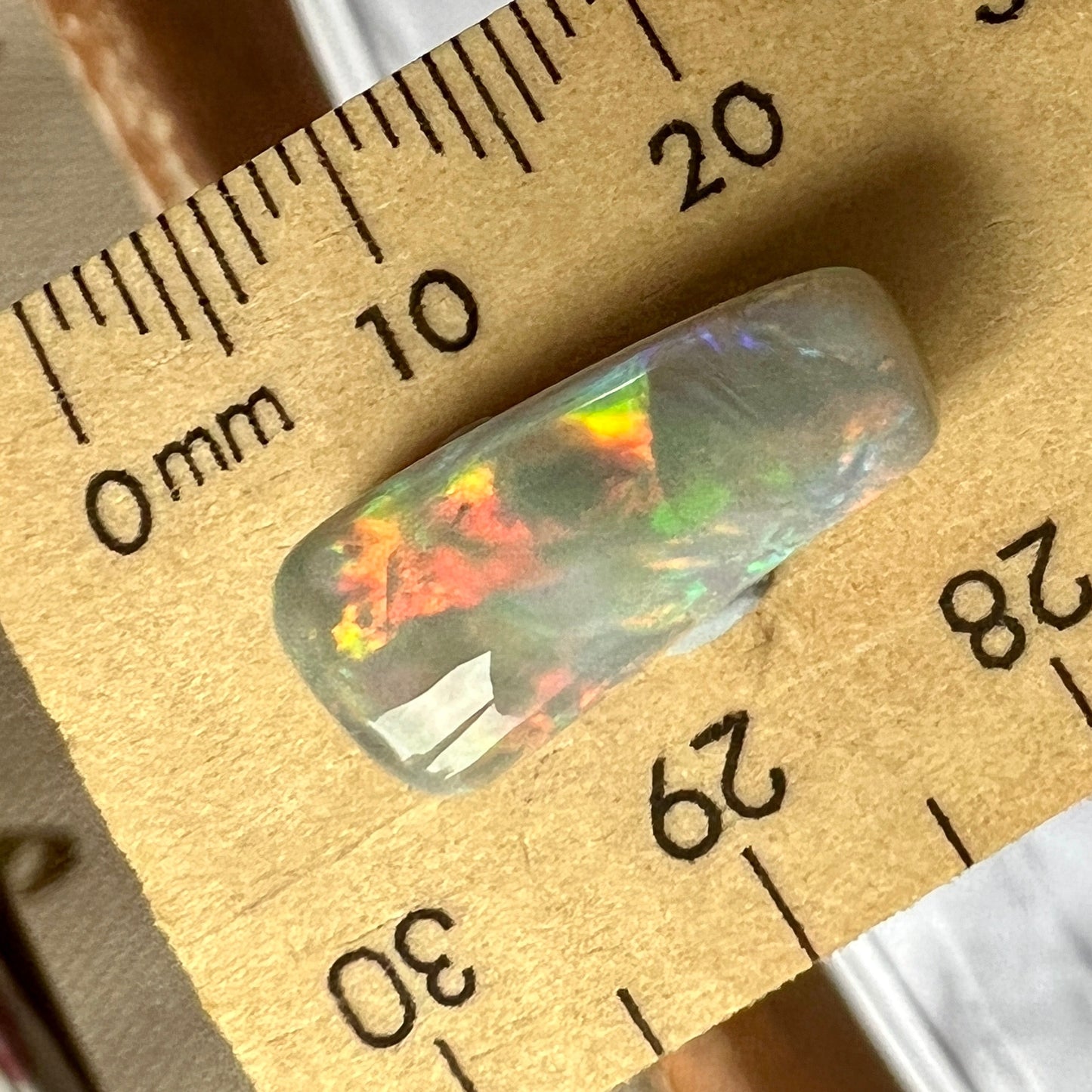 Absolutely stunning piece of rare Mintabie opal, displaying fiery colours from every angle.