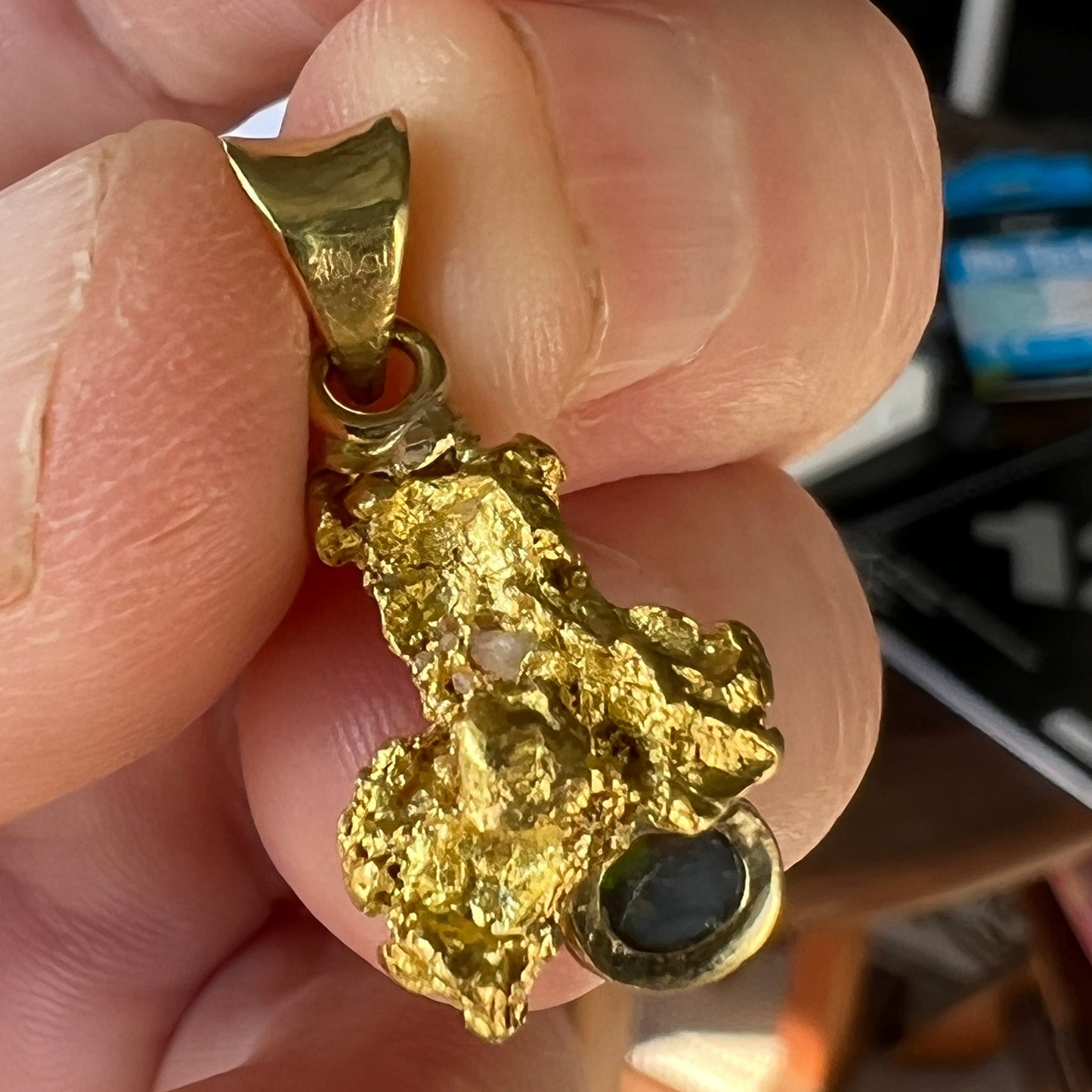 Pure gold nugget pendant from Western Australia, perfectly set and balanced with 18ct bale. Set with a beautiful Lightning Ridge solid black opal.