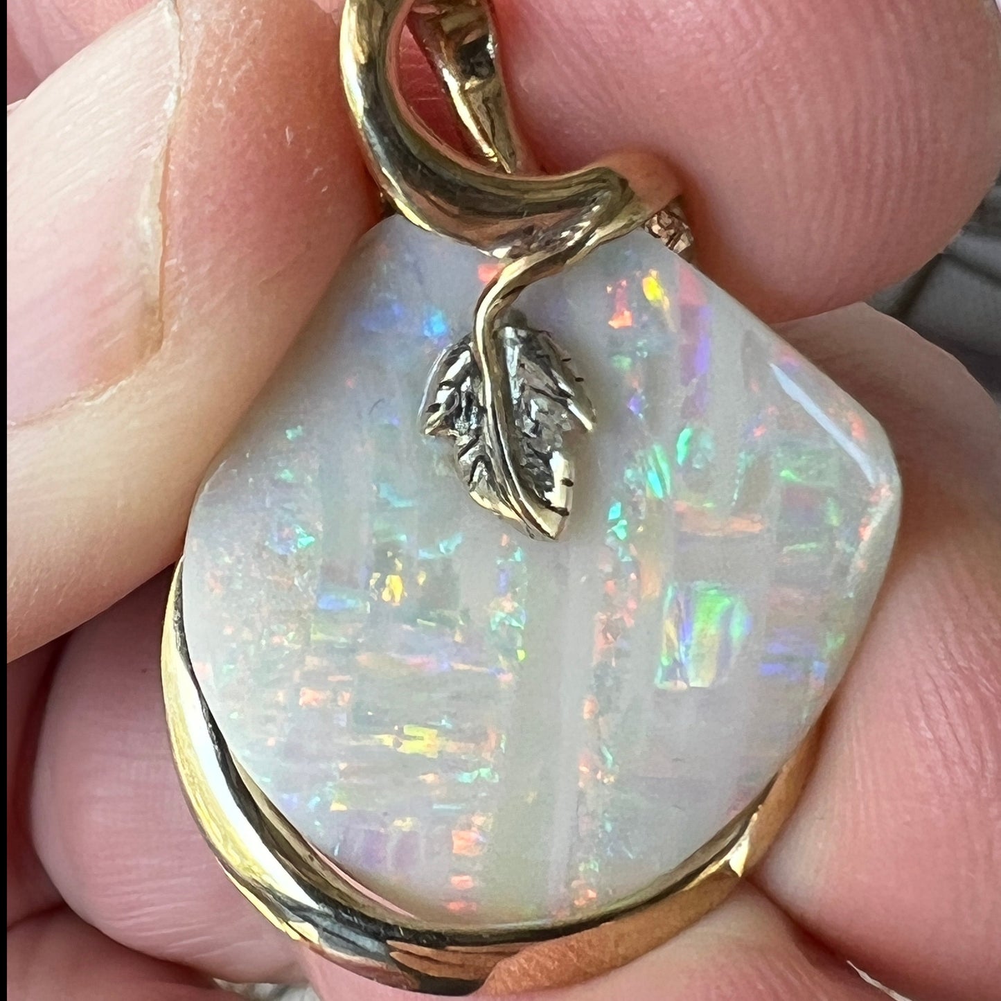 Beautiful solid vertical Mulga opal from the mines of Craig Haxton in Lightning Ridge. Gorgeous yellow gold and white gold setting with a platinum leaf, showcasing all of the Autumnal colours. Another Sally Fisher masterpiece.