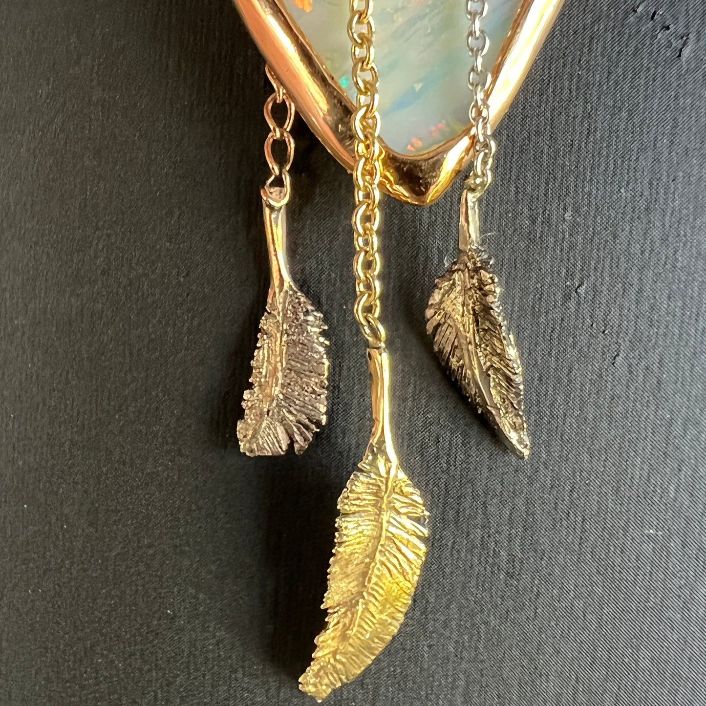 Beautiful solid vertical Mulga from the mine of Craig Haxton in Lightning Ridge. Set in a mixture of 9ct, 18ct, and Platinum gold, beautifully handcrafted by the talented Sally Fisher. A masterpiece.