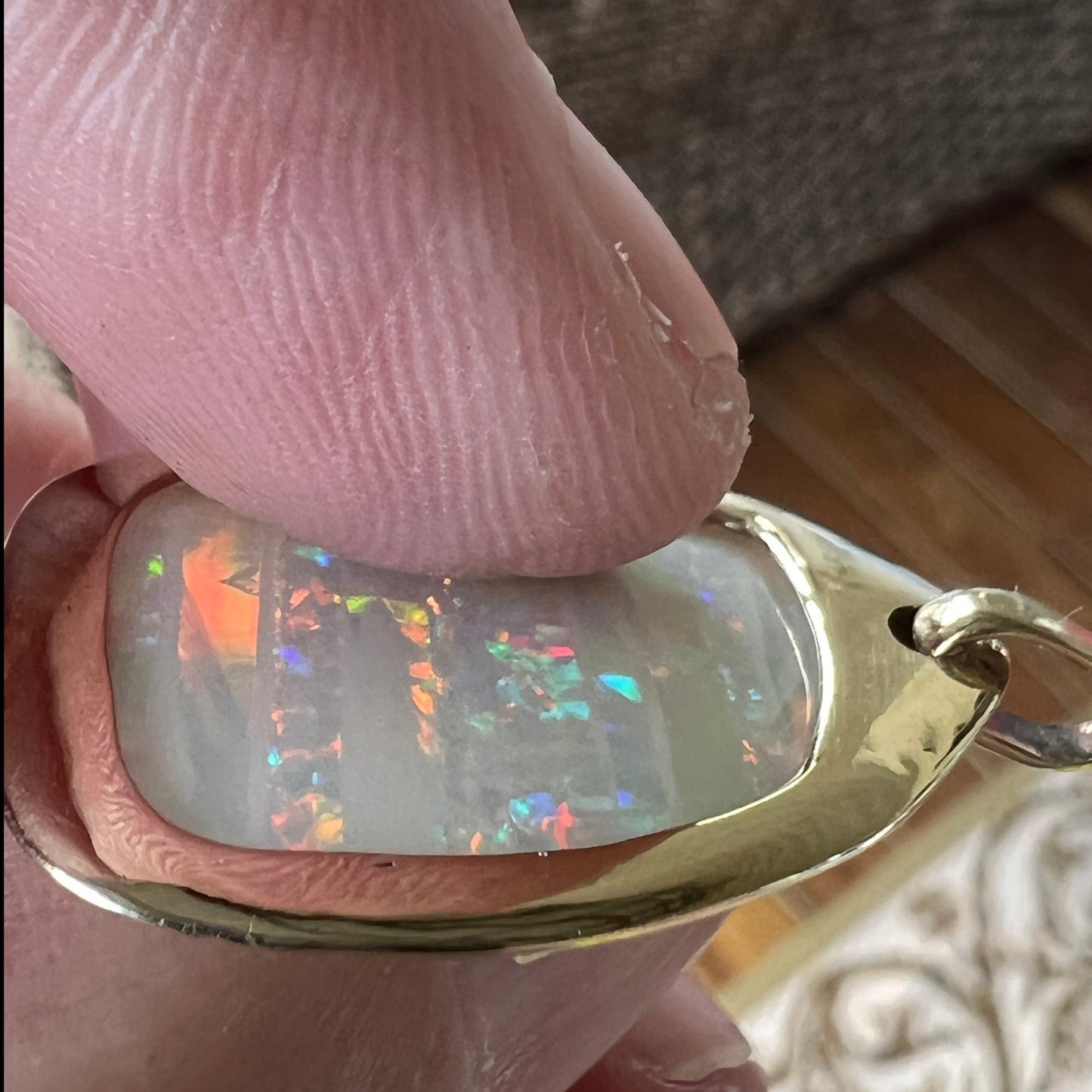 Beautiful solid vertical Mulga from the mine of Craig Haxton in Lightning Ridge. Set in a very simple but classic gold pendant, hand crafted by Sally Fisher.