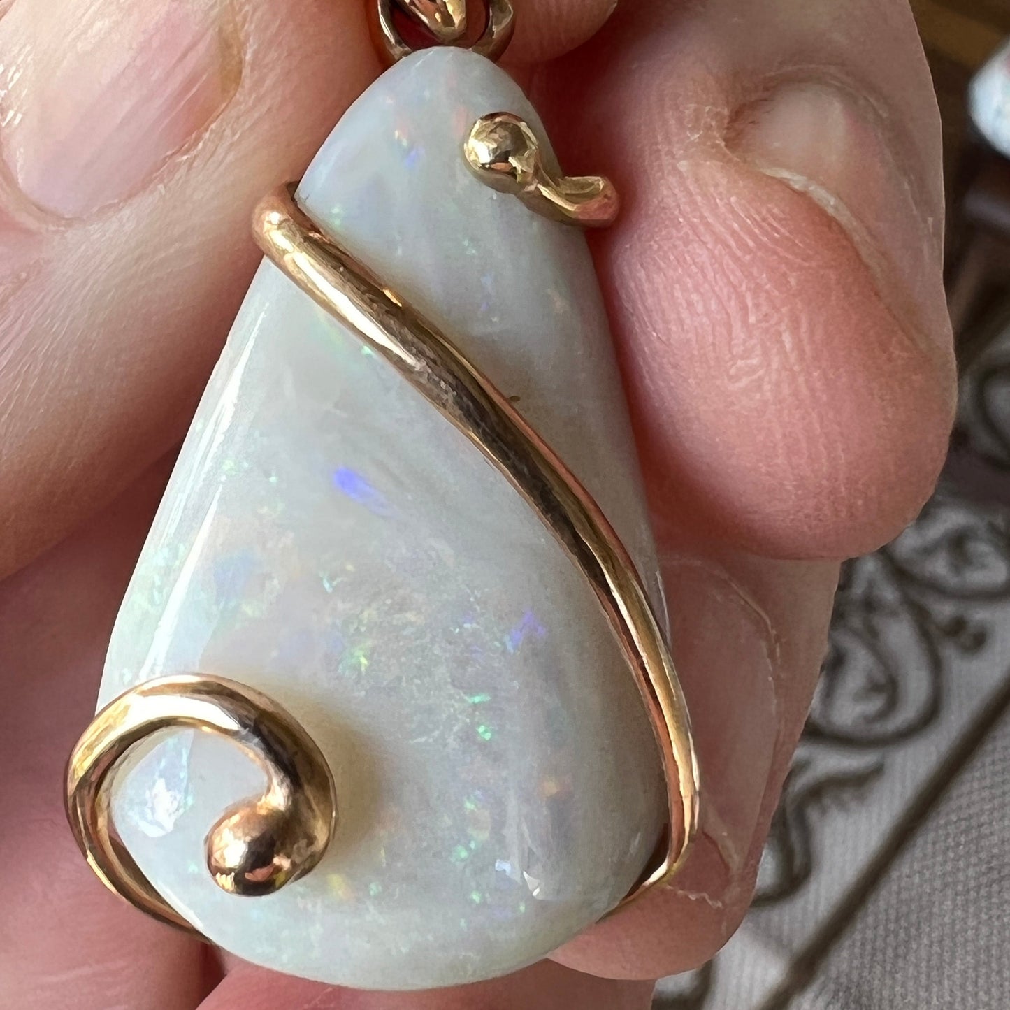 Beautiful solid Australian opal set in a unique 18ct gold design. A beautiful pendant.