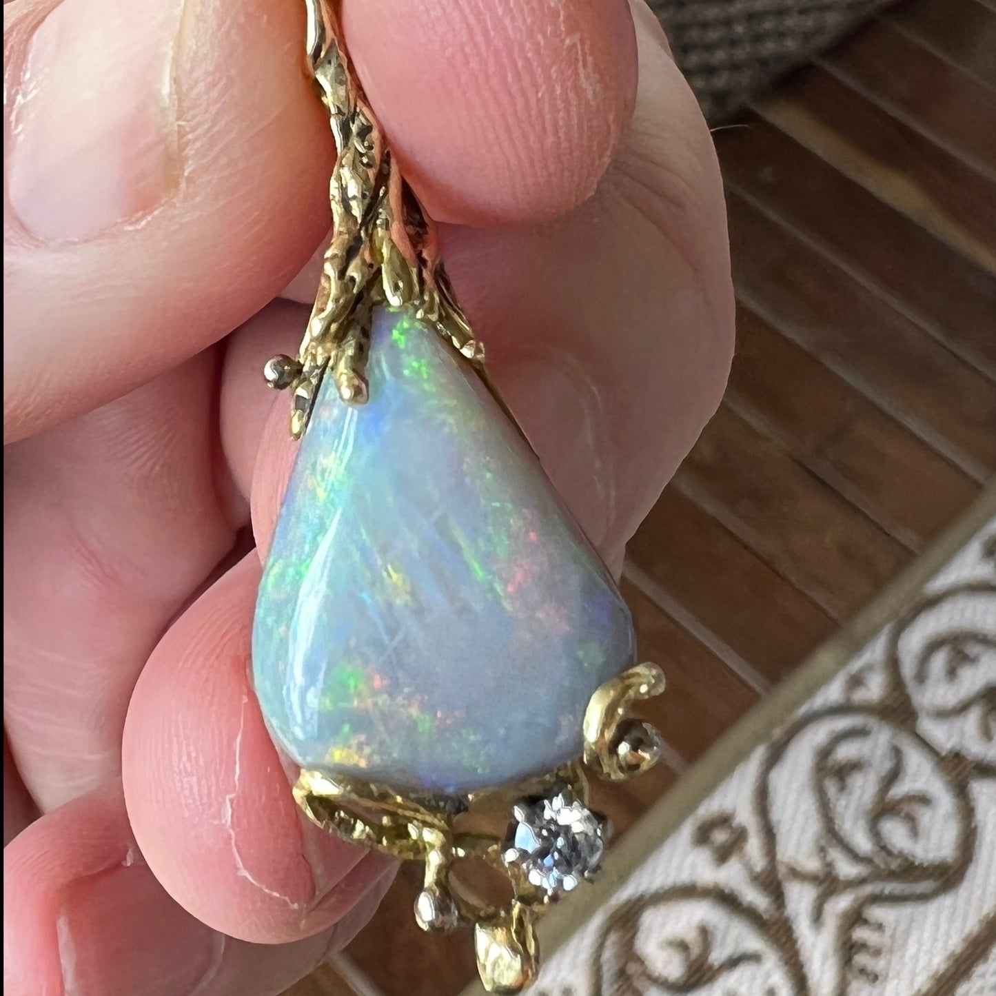 Stunning pendant hand made by Sally Fisher. Beautiful 8.5ct Lightning Ridge black opal mined 25-30 metres below what is now the 'Black Opal Motel'. Moulded 18ct gold finished off with a brilliant cut diamond. A masterpiece.