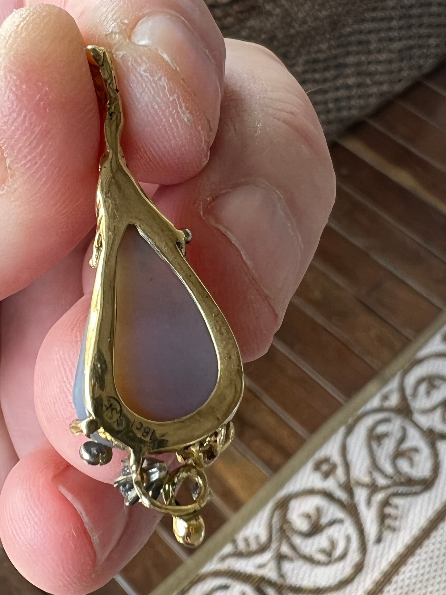 Stunning pendant hand made by Sally Fisher. Beautiful 8.5ct Lightning Ridge black opal mined 25-30 metres below what is now the 'Black Opal Motel'. Moulded 18ct gold finished off with a brilliant cut diamond. A masterpiece.