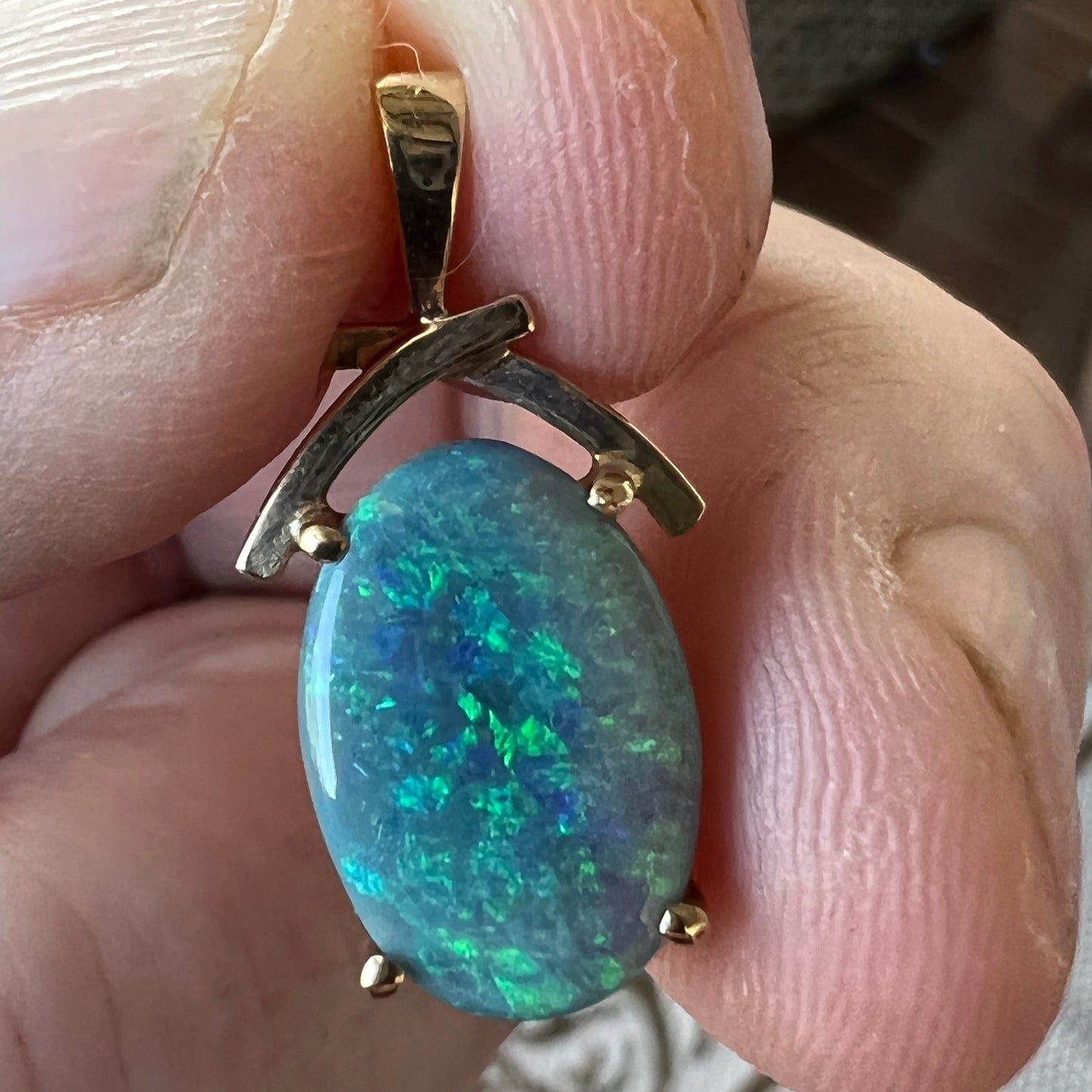 Beautifully cut Lightning Ridge Crystal opal displaying awesome greens. Set in a 14ct gold pendant. Cut and polished by Bill Johnson. Priced to sell.