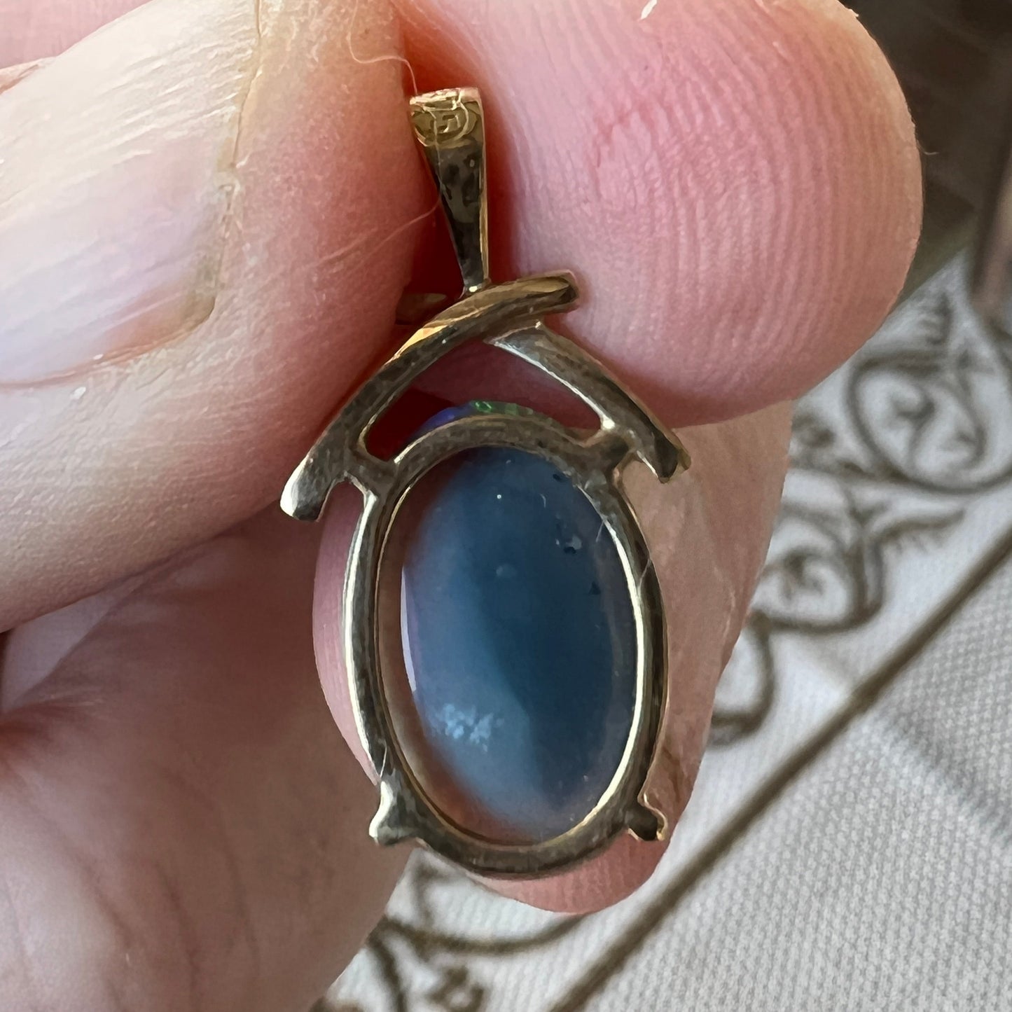 Beautifully cut Lightning Ridge Crystal opal displaying awesome greens. Set in a 14ct gold pendant. Cut and polished by Bill Johnson. Priced to sell.