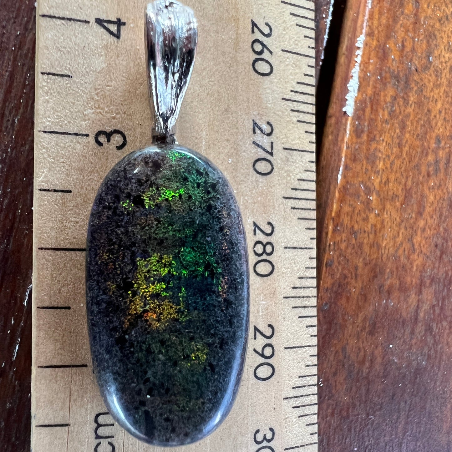 Andamooka Matrix opal pendant. Stunning colours in this lovely stone. Polished beautifully and ready to wear.