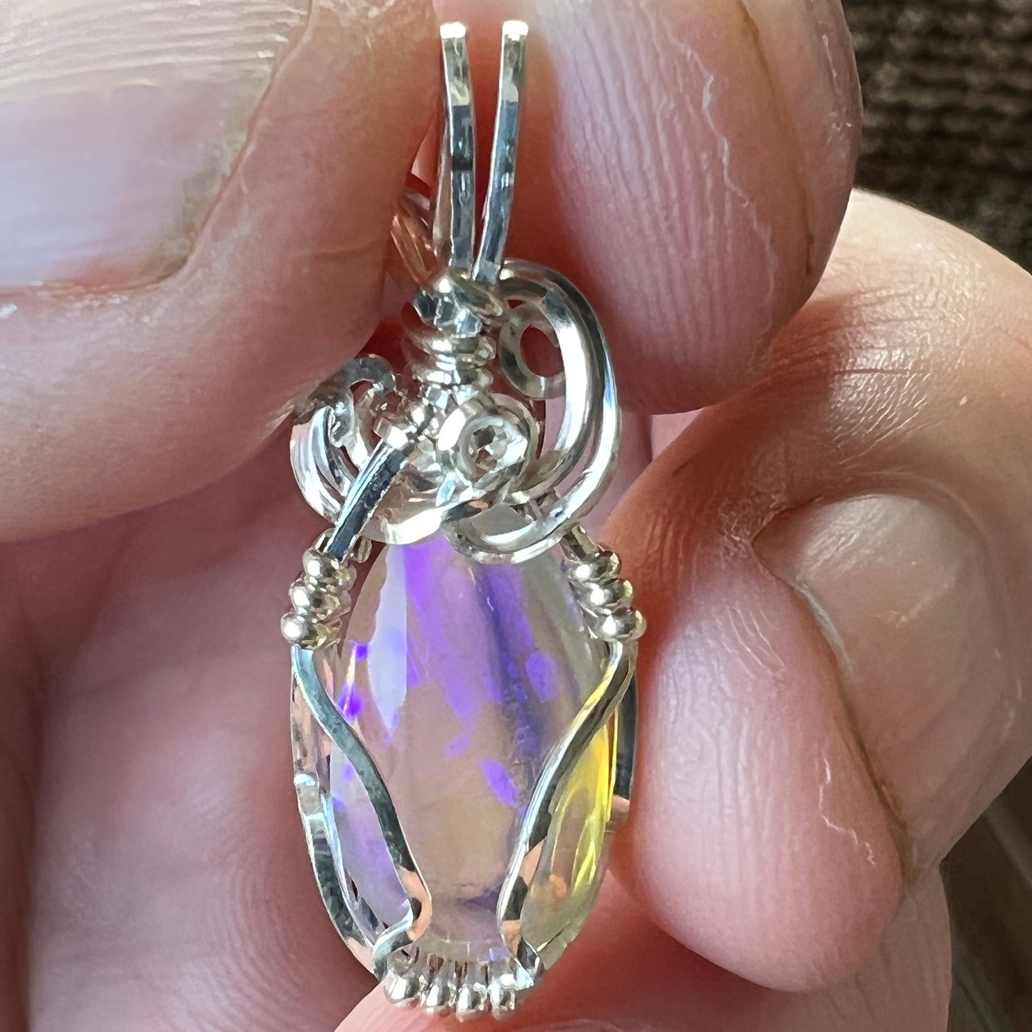 Beautifully cut Lightning Ridge Jelly Crystal opal. Cut and polished by Bill Johnson. Expertly set in a unique silver wire wrap. An awesome hand made gift.