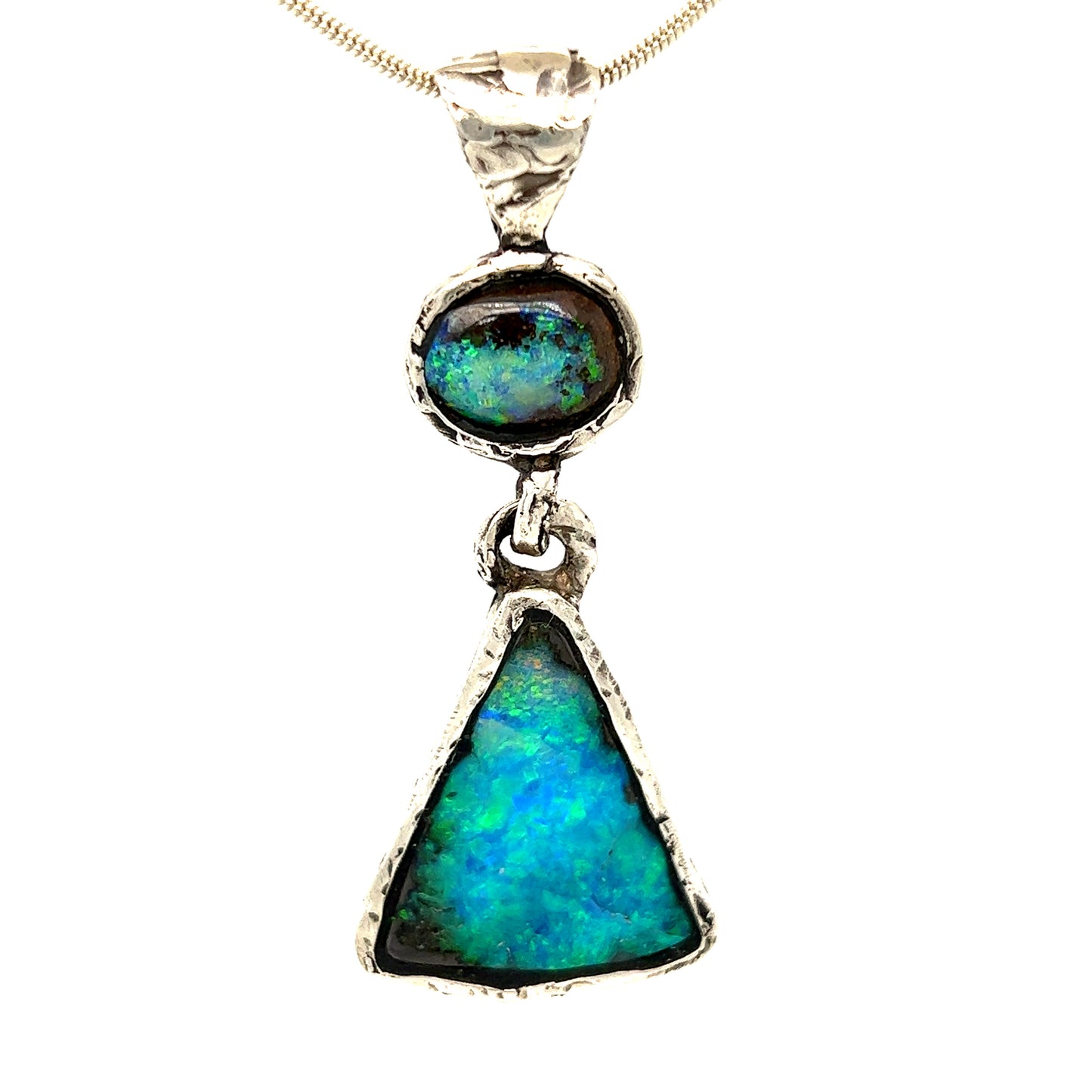 Stunning one-off hand made solid Boulder opal pendant. Hinged between stones to allow movement. Highly textured to enhance rawness. Made with Argentium silver - a higher silver content using part recycled silver, and a lower allergenic. Crafted by Sally Fisher.