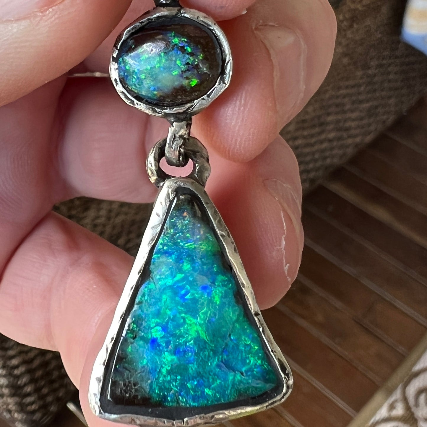 Stunning one-off hand made solid Boulder opal pendant. Hinged between stones to allow movement. Highly textured to enhance rawness. Made with Argentium silver - a higher silver content using part recycled silver, and a lower allergenic. Crafted by Sally Fisher.