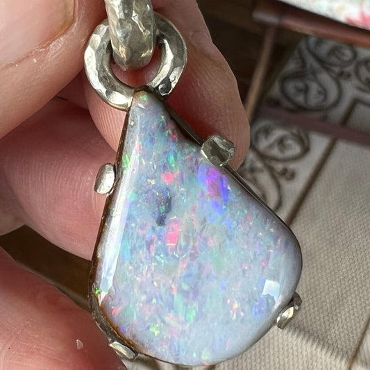 Another beautiful solid opal pendant from the Argentium silver range. Beautiful Queensland Boulder opal showing pinks, blues and greens. Absolutely stunning.